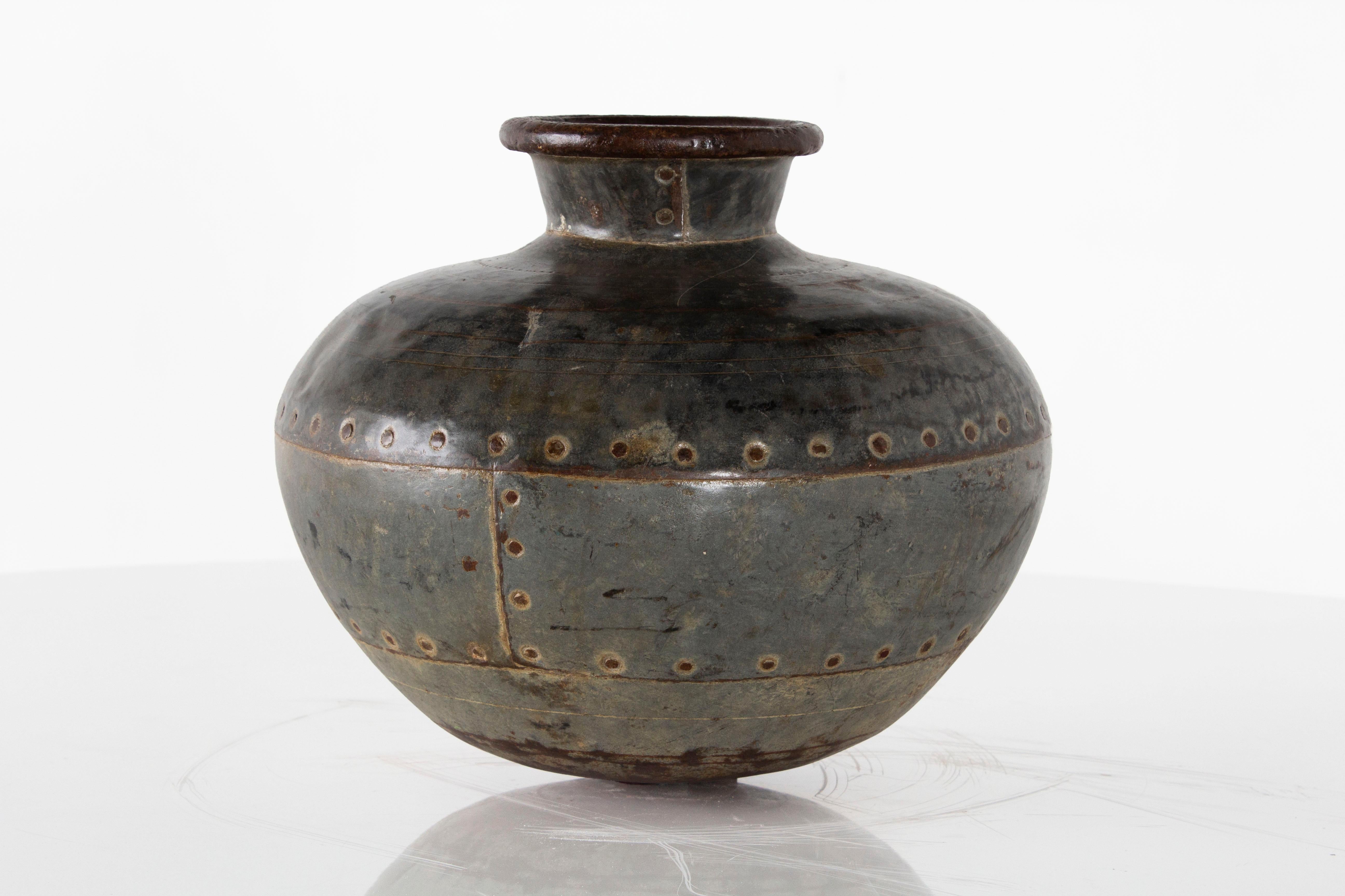 Vintage rivet urn from Europe 

Pot, vase, jar intended for decor use.