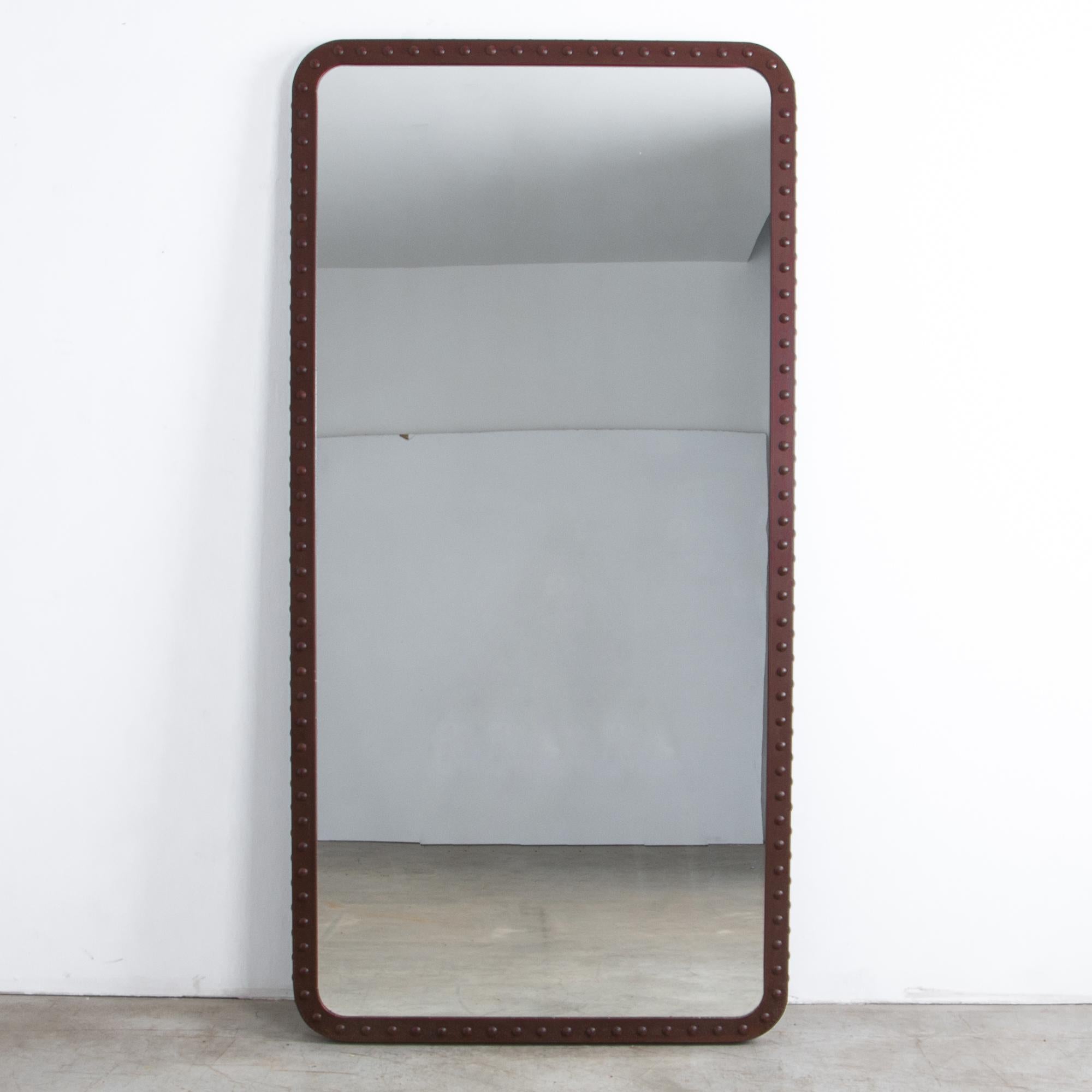 A prototype from our atelier, this mirror interprets the architecture of antiquated factories. Riveted iron bars become a decorative motif. An industrial aesthetic meets an old-world elegance, seen through a clean and contemporary lens.