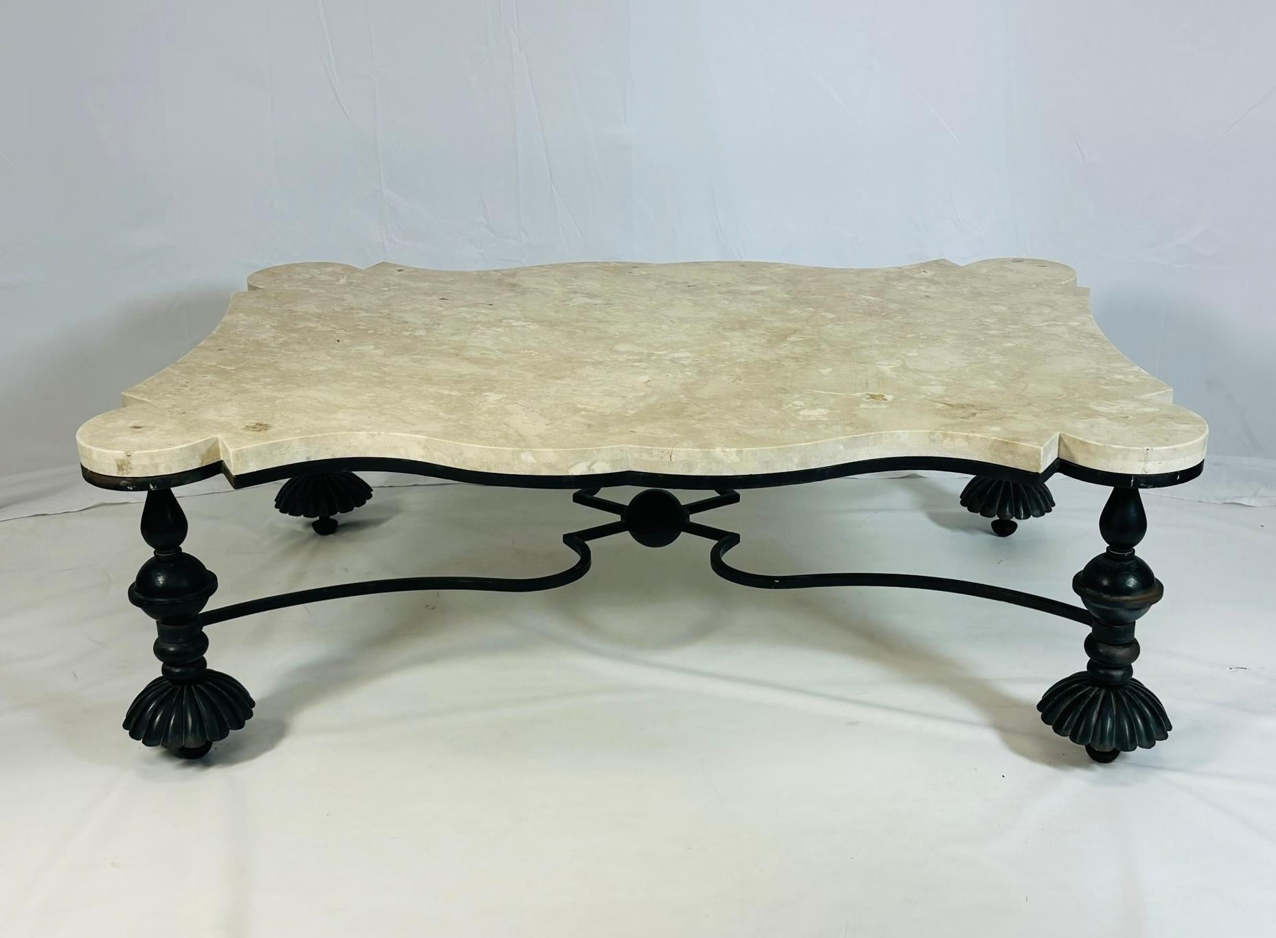 Stunning coffee table designed and manufactured in the United States by Jean de Marry.

The piece is made out of wrought iron and topped with a cream marble top.

The piece has a beautiful shape and architectural lines.

Measurements:
60 inches wide