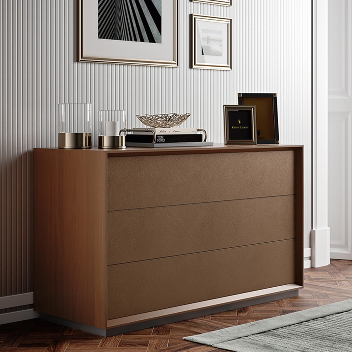 A superb synthesis of modern style elevated by consistent tailored details, this exclusive dresser will complete the look of any bedroom in a neutral color palette. The dark finish of the Canatto walnut-veneered MDF structure is matched by the