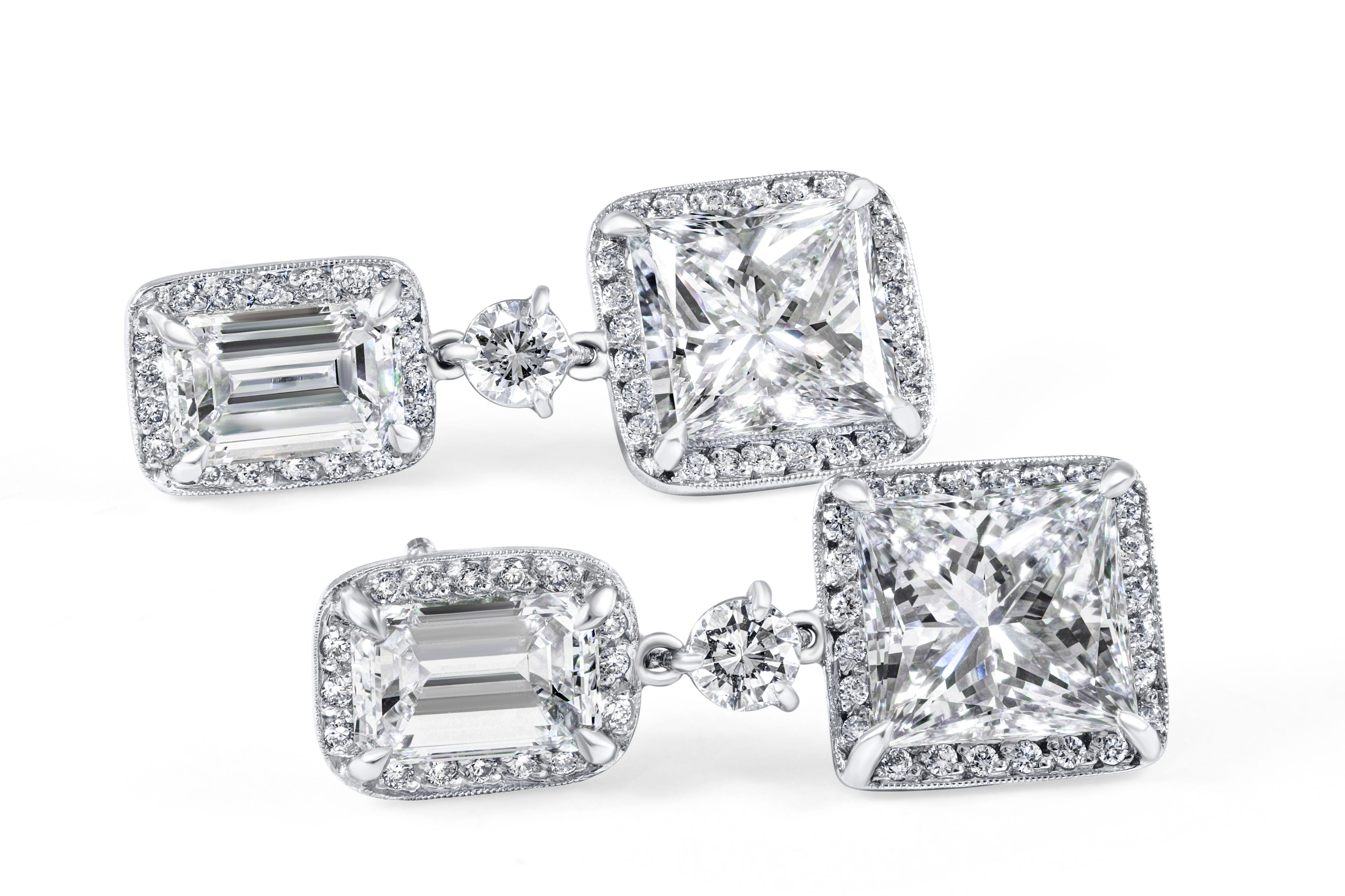 Rivièra Platinum Princess and Emerald Diamond Drop Earrings exclusively designed and created in-house at CJ Charles Jewelers. These spectacular earrings are crafted from platinum, and set with GIA certified 1.08ct and 1.05ct emerald cut diamonds,