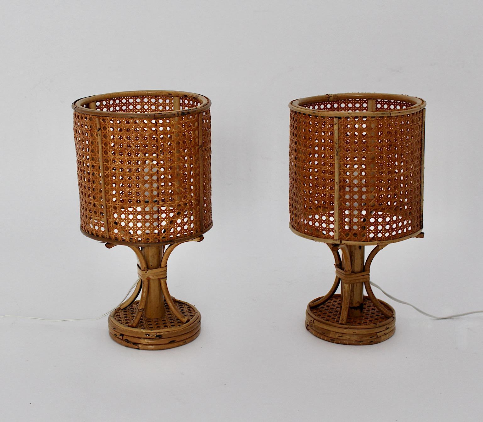Riviera style Organic vintage pair of table lamps or nightstand lamps from rattan and bamboo designed and executed in Italy 1970s.
A wonderful pair of table lamps or nightstand lamps with lamp shades from Viennese mesh, while the base shows rattan