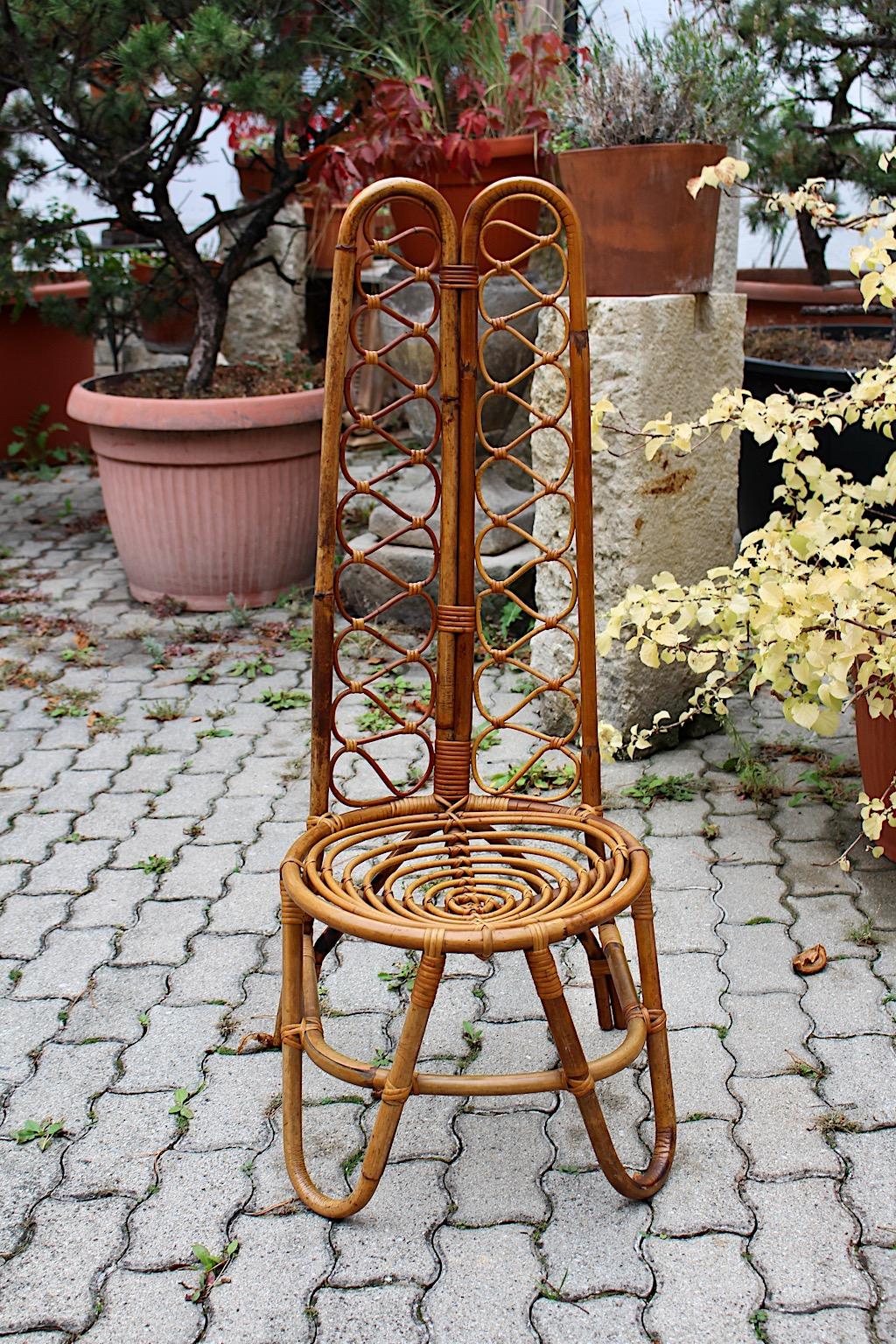 Riviera style vintage organic side chair with highback seat attributed to Bonacina 1960s, Italy.
A stunning solo vintage organic highback chair in brown color with beautiful wickerwork.
This side chair could perfectly work as side chair combining