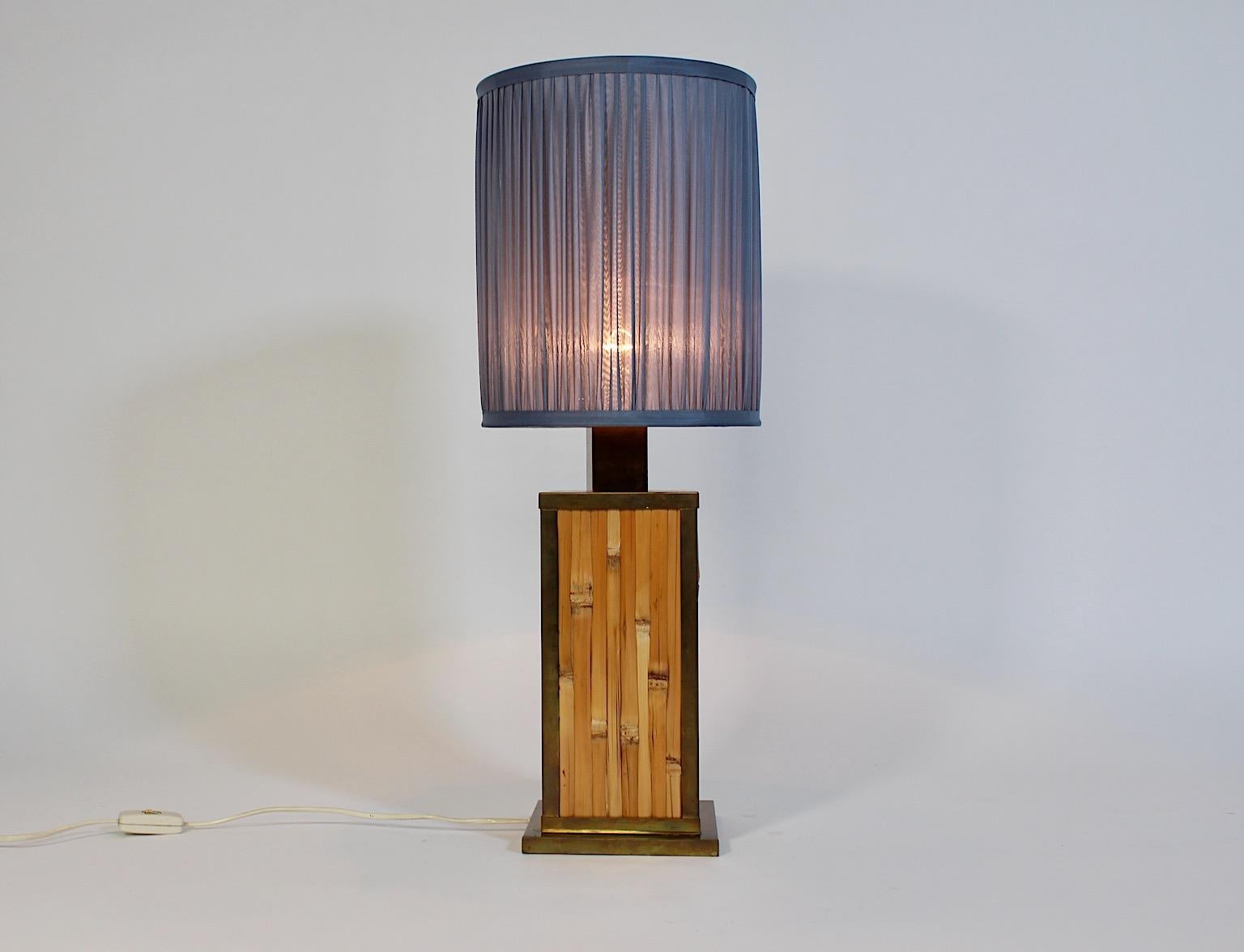 Riviera Style vintage table lamp from bamboo, brass and pleated silk 1970s Italy.
A charming table lamp  with a rectangular base from bamboo and a brass trim, while the new hand custom made lamp shade is made of pleated silk in pastel blue