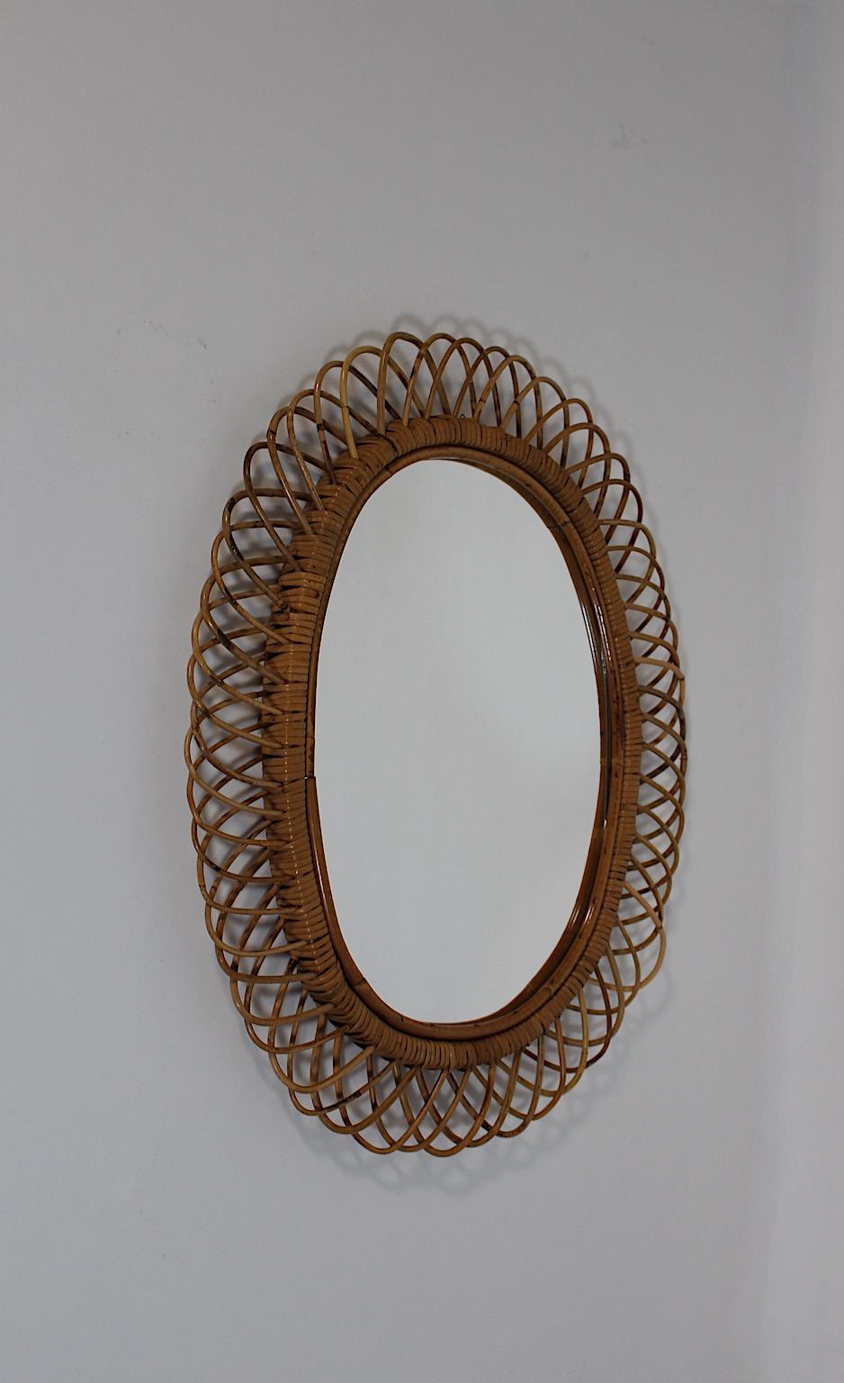 Riviera Style Vintage Rattan Oval Wall Mirror Sunburst Mirror, 1960s, Italy In Good Condition For Sale In Vienna, AT