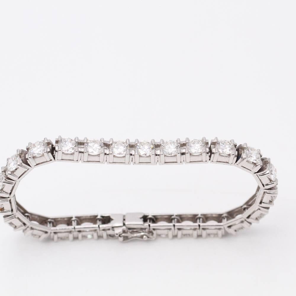 Women's Diamond and Gold Bracelet  25x Brilliant Cut Diamonds with a total weight of 13.25ct. in G/VS quality, (individual stones of approx. 0.50ct. each).  18kt White Gold  29,33 grams  17,5 cm long  17,5 cm long  Drawer clasp with 2x safety lugs 