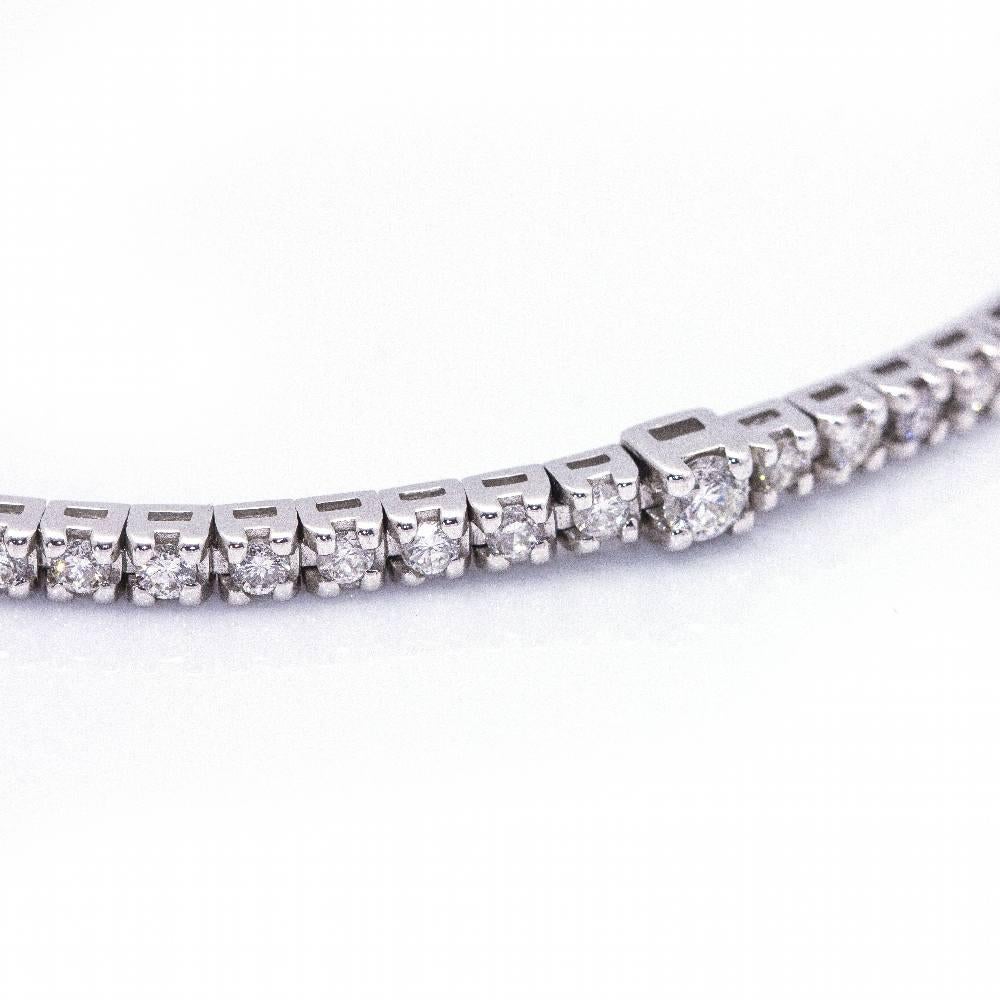 Italian firm DAMIANI Riviere bracelet in Gold and Diamonds for woman  82x Brilliant cut Diamonds weighing 1,40cts. in G/Vs quality  18kt White Gold  7,75 grams  Solid  Drawer clasp with 1x safety catch.  Measures: 18cm in length  Brand new product 