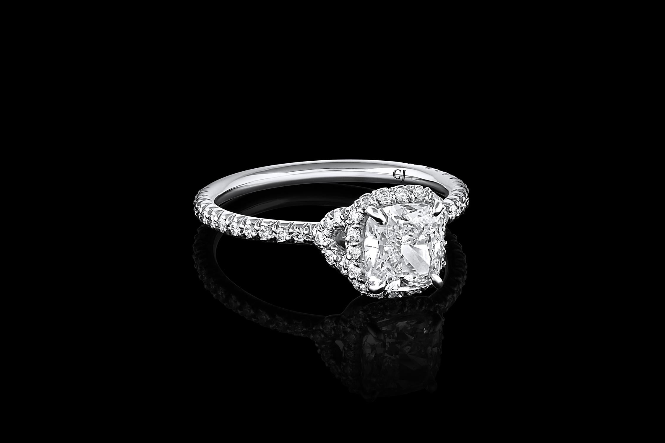 The Rivière Collection is exclusively designed and created in-house at CJ Charles Jewelers.

This elegant engagement ring is crafted of platinum and showcases a 1.20 carat cushion cut diamond with I color and SI1 clarity. It features a diamond halo
