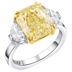 Rivière Platinum 5.01 Carat Fancy Yellow Diamond and Half Moon Diamond Ring