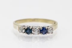 Rivière ring with sapphires and old-cut diamonds.