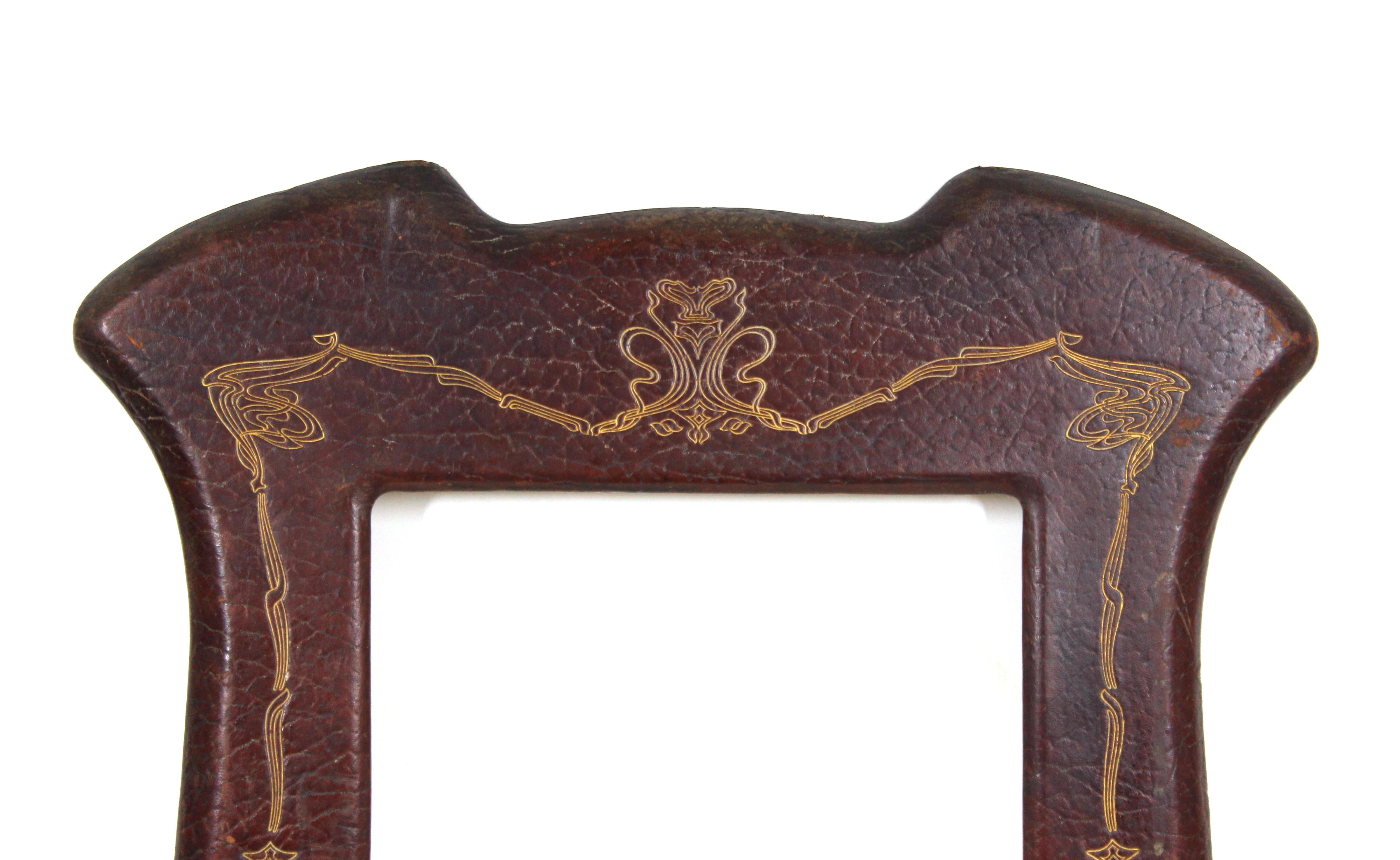 German Jugenstil picture or mirror desk frame in elaborately tooled and gilt leather. The piece was made in circa 1905 by A. Rixner in Linz, Germany. Makers mark on the front and stamp on the back side: 