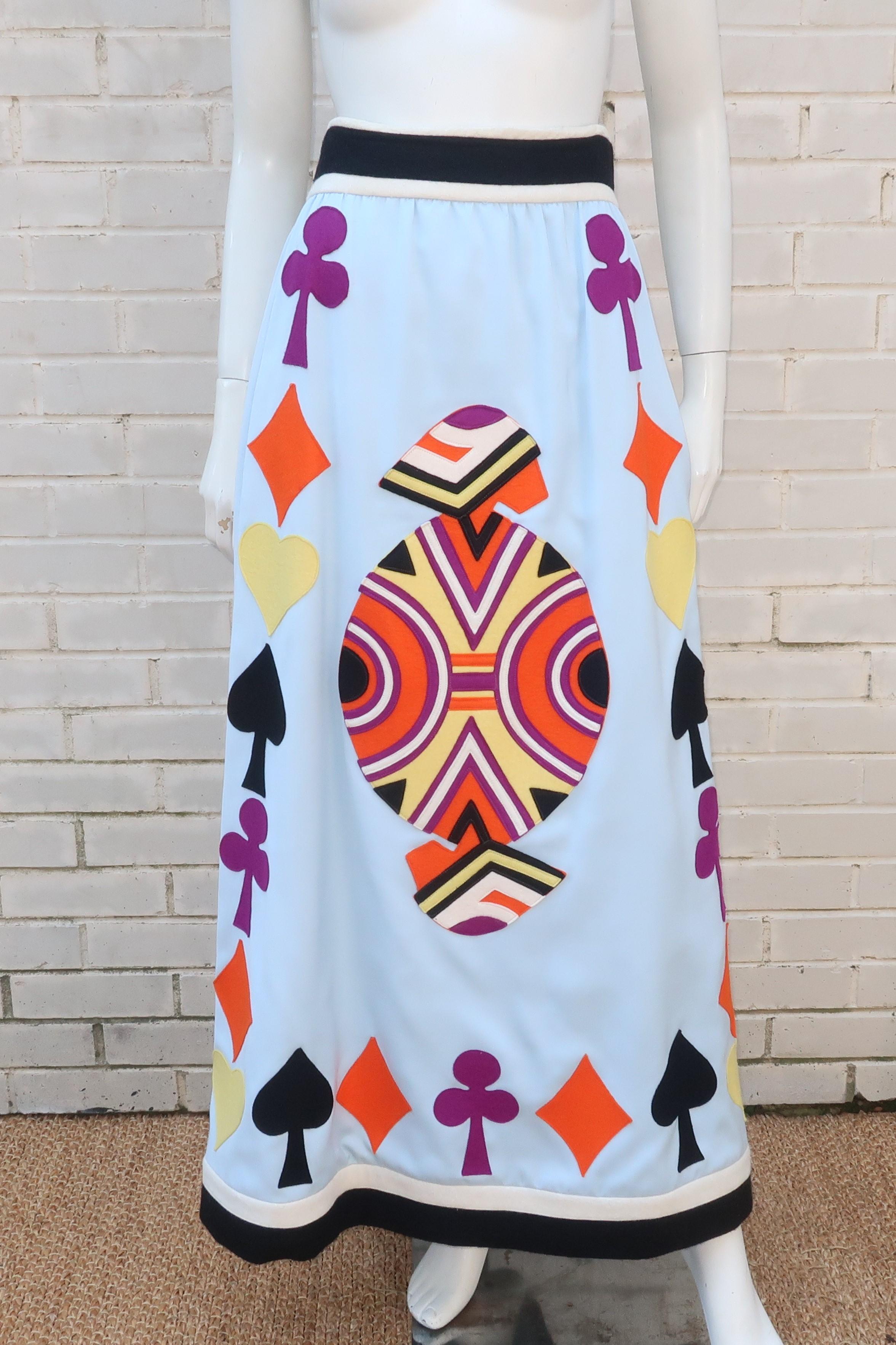 It's game night and Egyptian designer, Youssef Rizkallah, for Malcolm Starr has fashioned an attention getting maxi skirt in a pale blue wool blend fabric with colorful playing card felt appliques just for the occasion.  The black and white