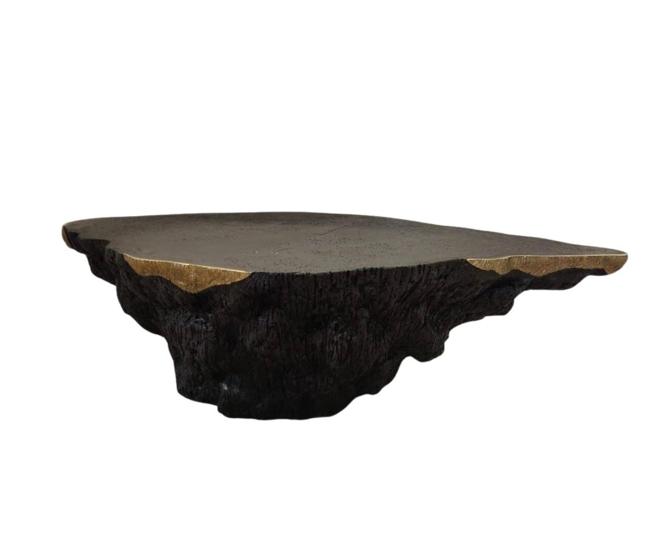 Handcrafted with rich fin textured coal and signature ‘bull nose’ brass accents, the Gelerio table converges both functional features and a statuesque appearance with ease that invites viewers to engage with it. 
The various finish possibilities