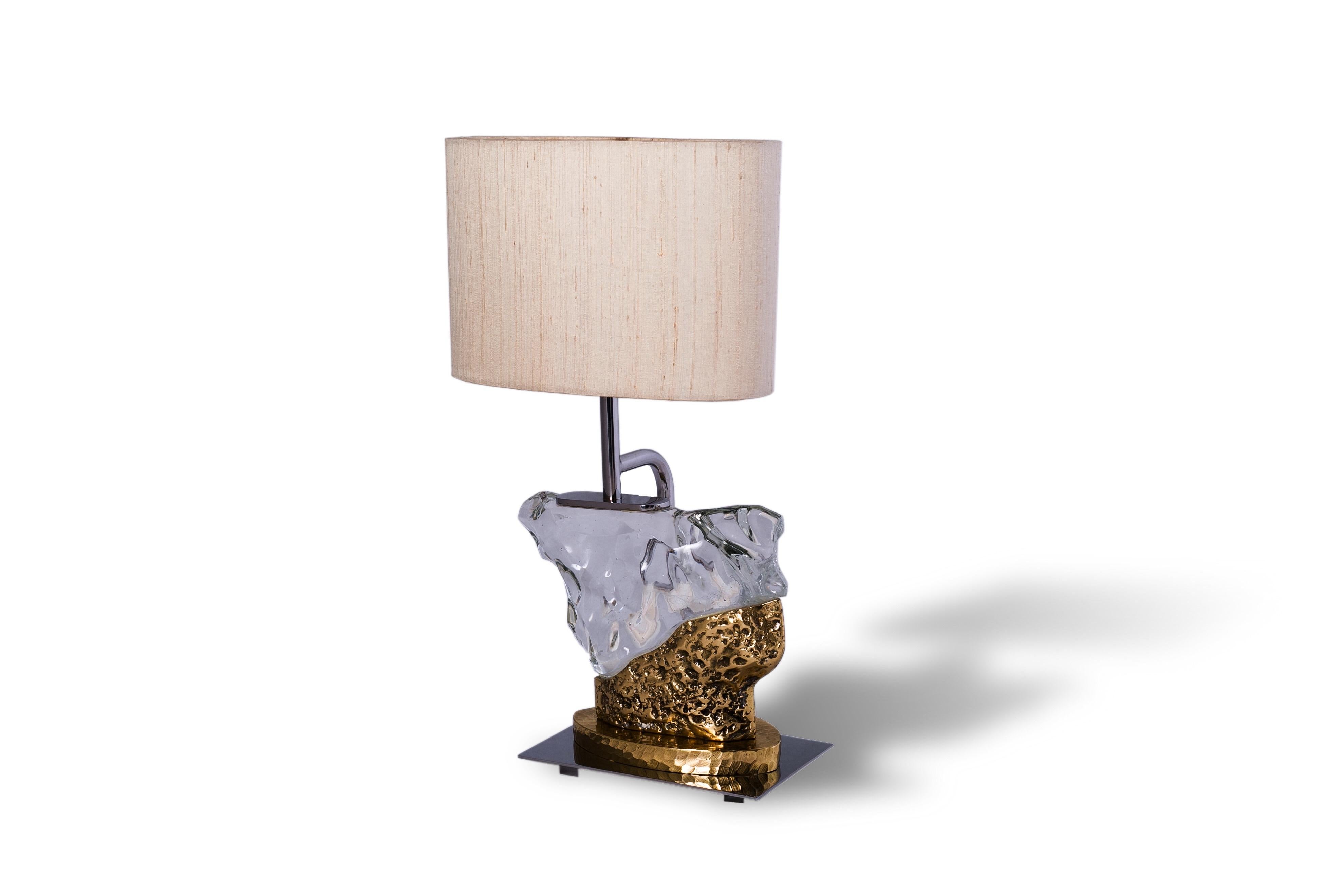 The Pacco table lamp presents itself as a couture modernist collectible for design aficionados. Inspired by the lunar surface and the concept of metamorphosis, these lighting pieces open an endless possibility for light compositions with impressive