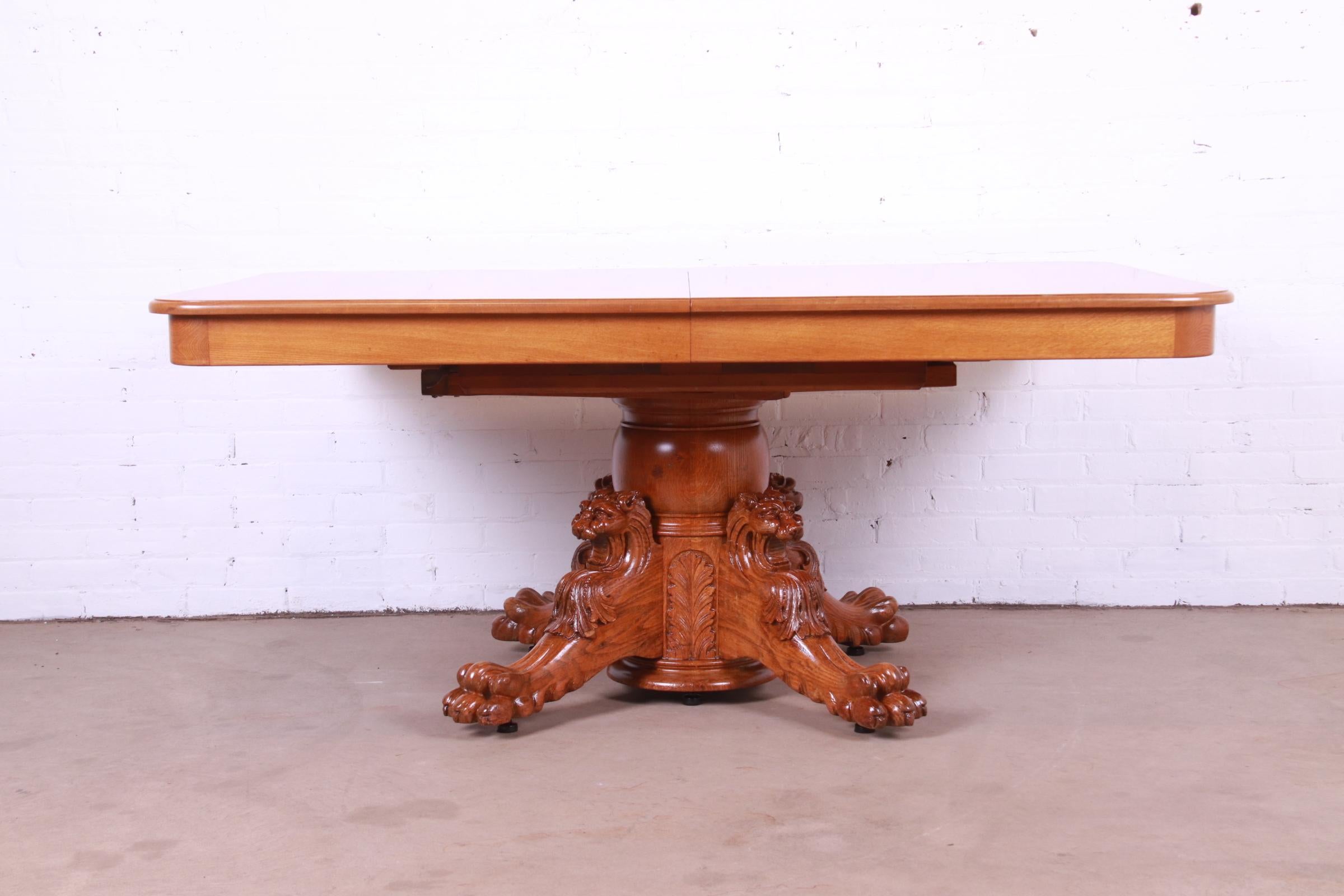 American R.J. Horner Antique Victorian Oak Pedestal Dining Table with Carved Lions For Sale