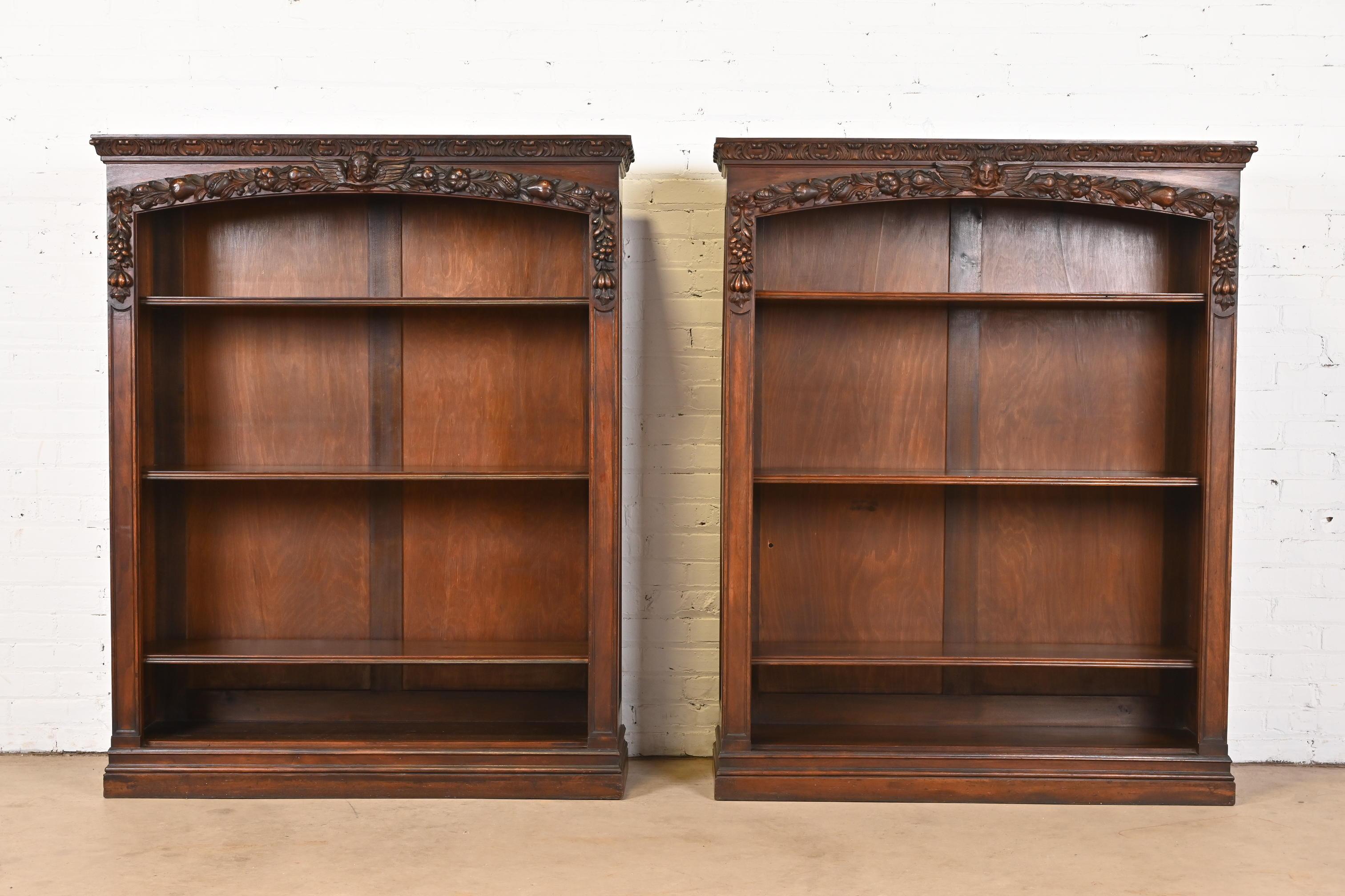 A gorgeous pair of antique Victorian or Renaissance Revival bookcases

In the manner of R.J. Horner

USA, Circa 1890s

Beautiful walnut, with carved angels and fruit.

Measures: 45.25W x 13.25