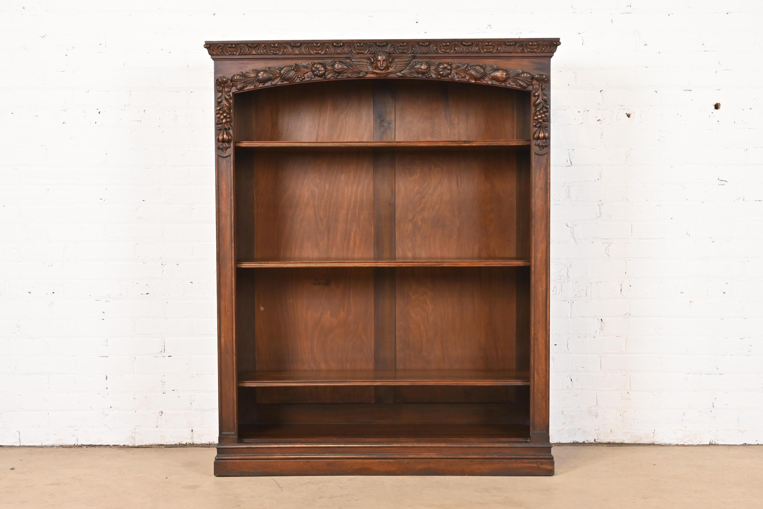 A gorgeous antique Victorian or Renaissance Revival bookcase

In the manner of R.J. Horner

USA, Circa 1890s

Beautiful walnut, with carved angels and fruit.

Measures: 45.25W x 13.25