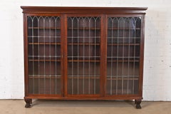 R.J. Horner Style Victorian Carved Mahogany Leaded Glass Triple Bookcase
