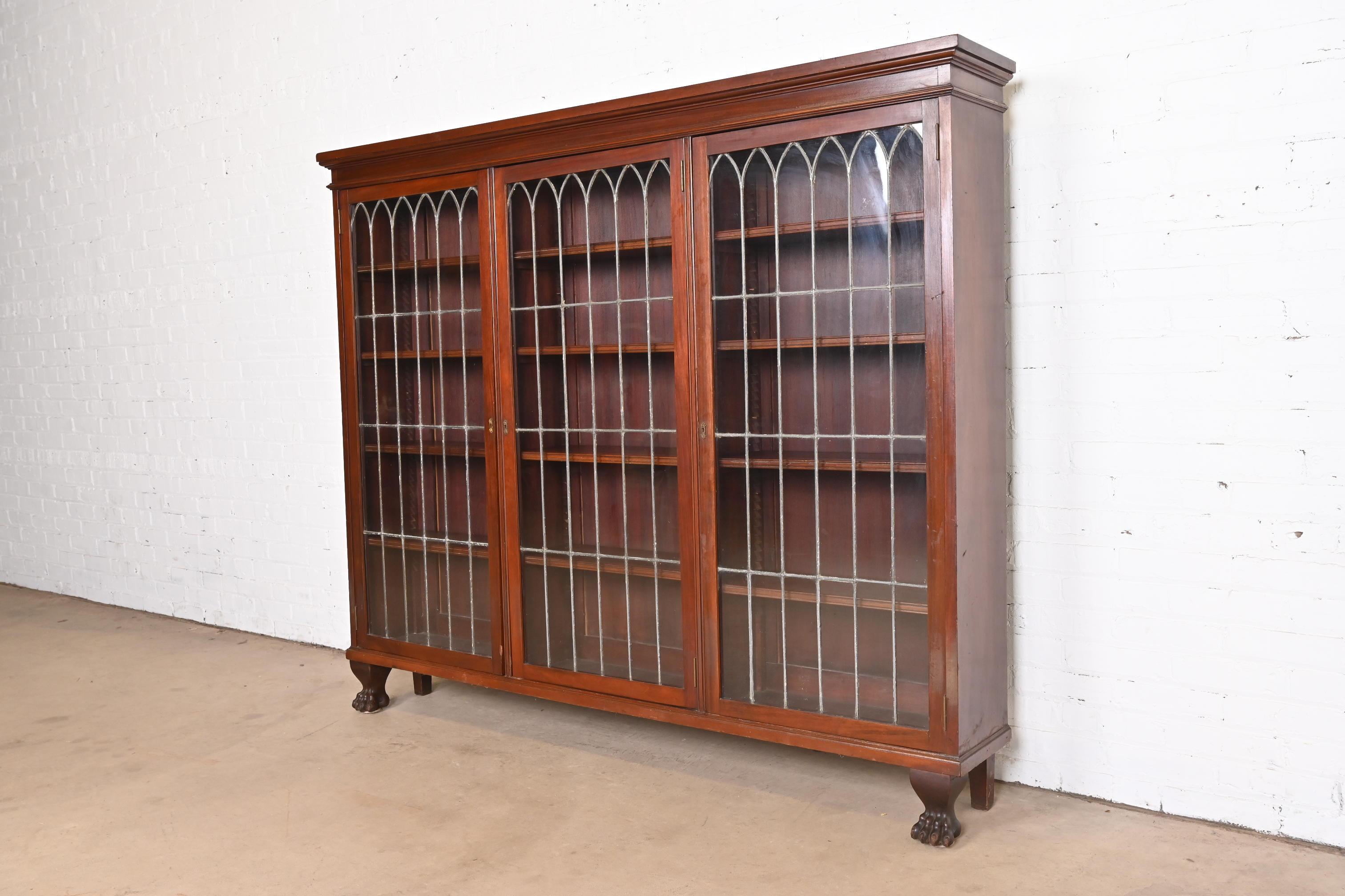 Late Victorian R.J. Horner Style Victorian Carved Mahogany Leaded Glass Triple Bookcase