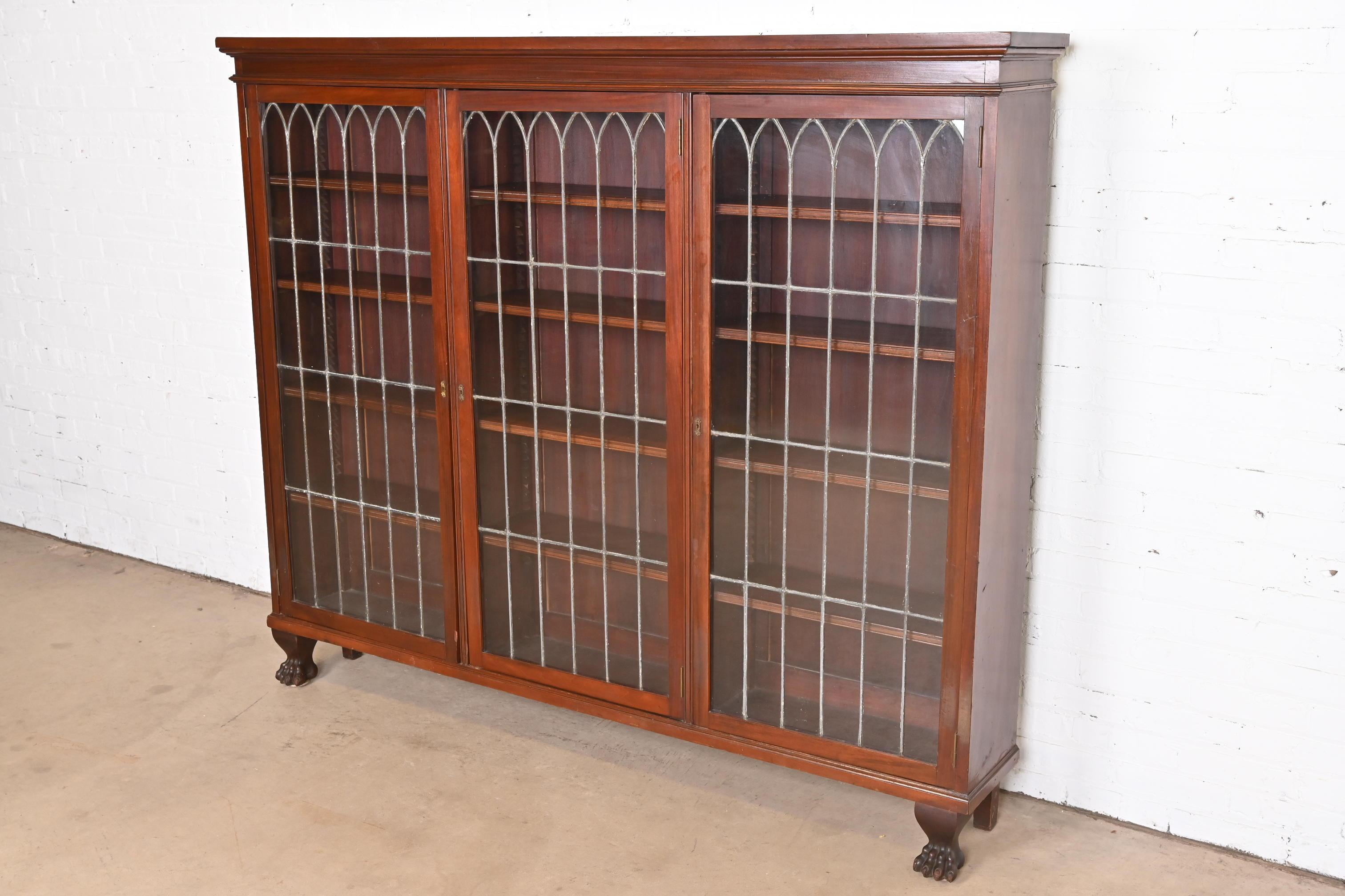 American R.J. Horner Style Victorian Carved Mahogany Leaded Glass Triple Bookcase