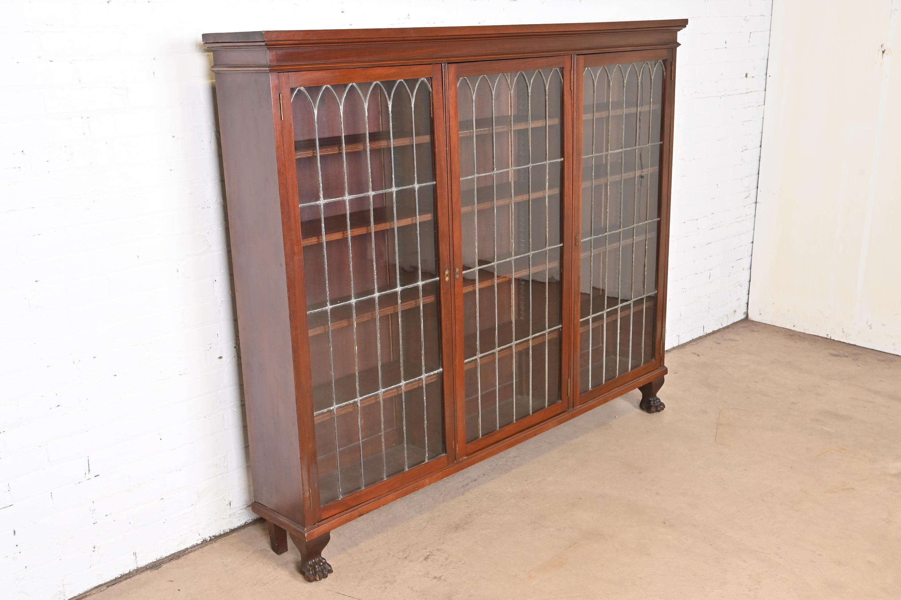 19th Century R.J. Horner Style Victorian Carved Mahogany Leaded Glass Triple Bookcase