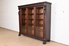 R.J. Horner Victorian Mahogany Triple Bookcase with Carved Griffins, circa 1890