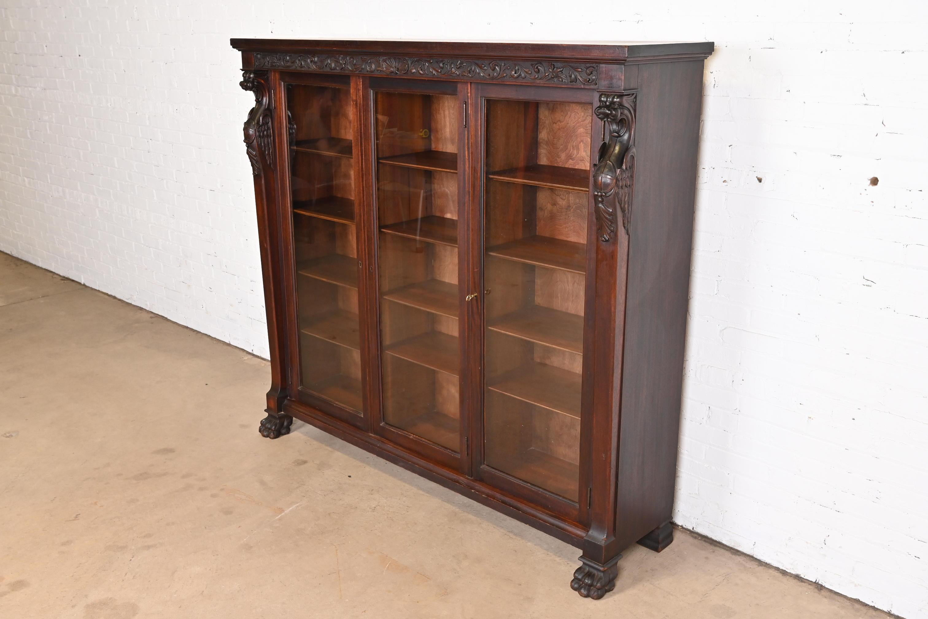 American R.J. Horner Victorian Mahogany Triple Bookcase with Carved Griffins, circa 1890