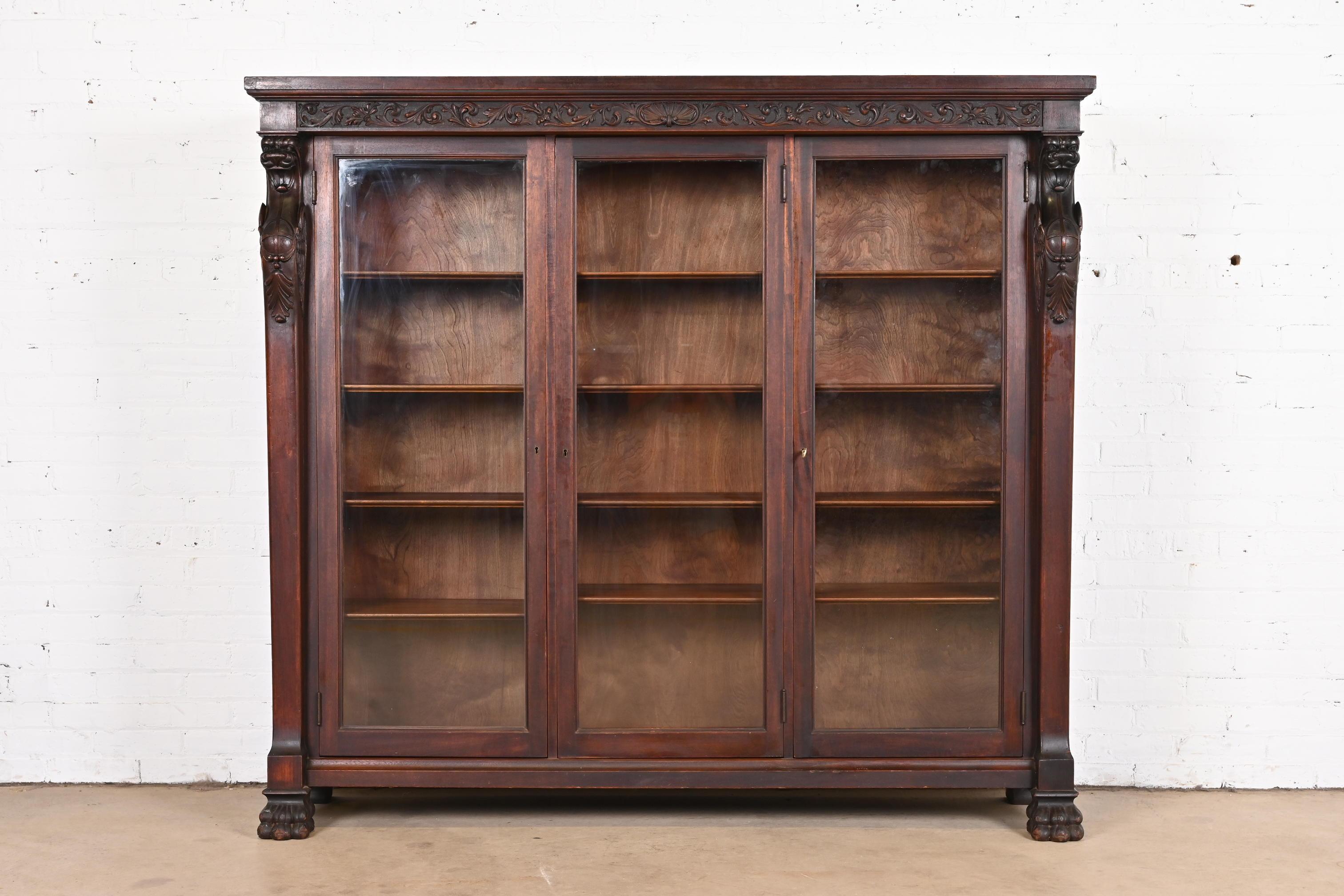 19th Century R.J. Horner Victorian Mahogany Triple Bookcase with Carved Griffins, circa 1890