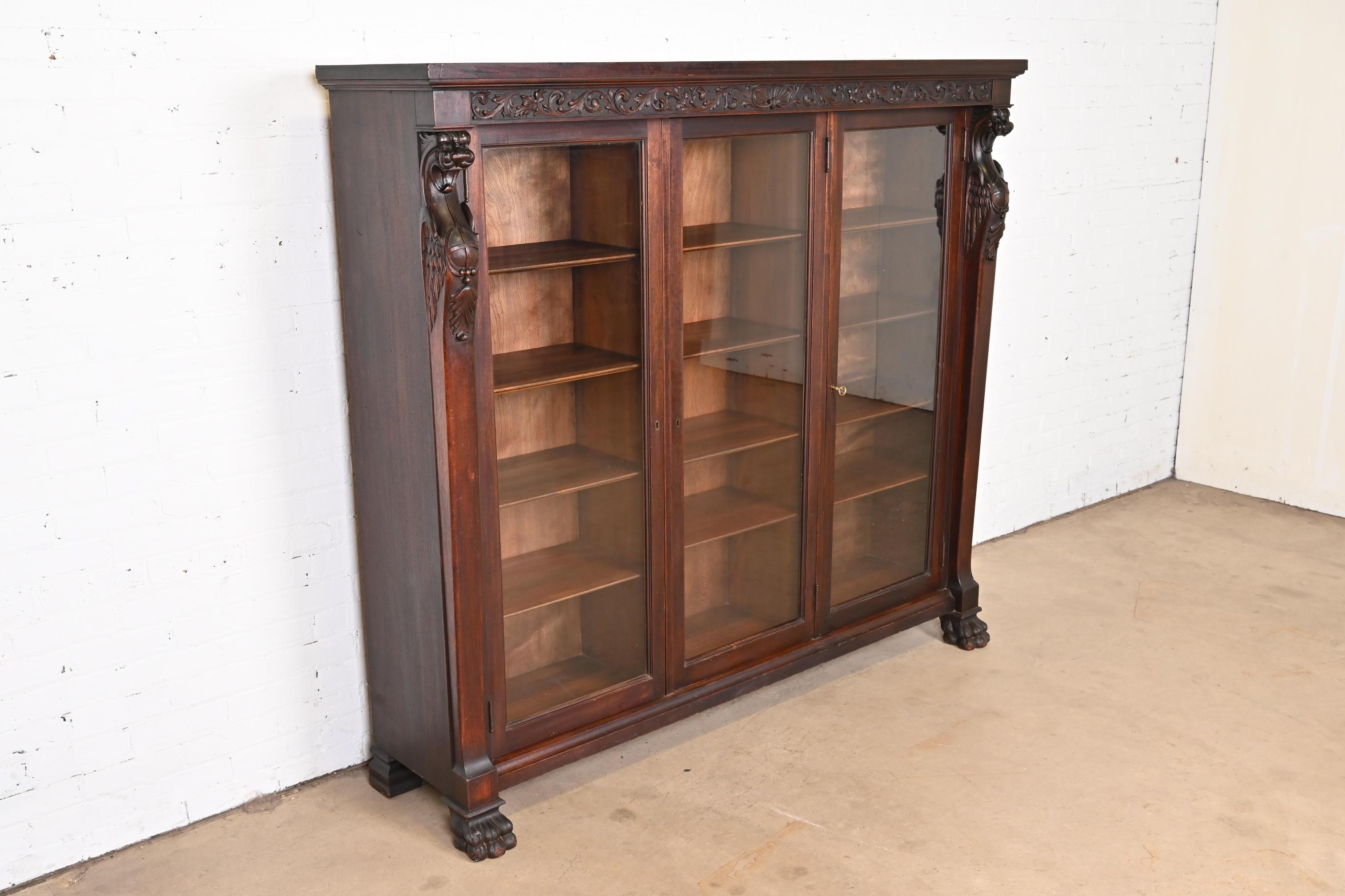 Glass R.J. Horner Victorian Mahogany Triple Bookcase with Carved Griffins, circa 1890