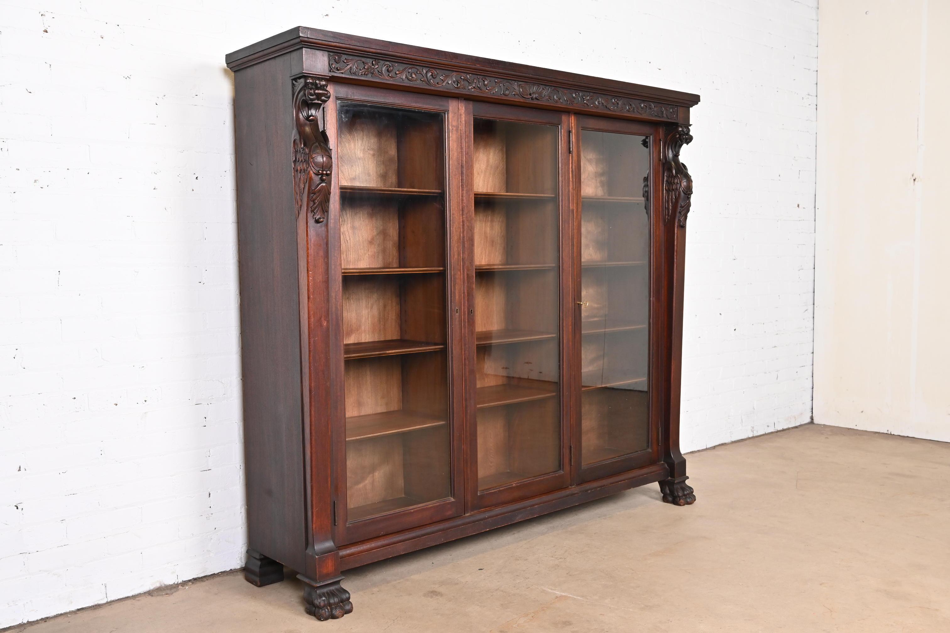 R.J. Horner Victorian Mahogany Triple Bookcase with Carved Griffins, circa 1890 1