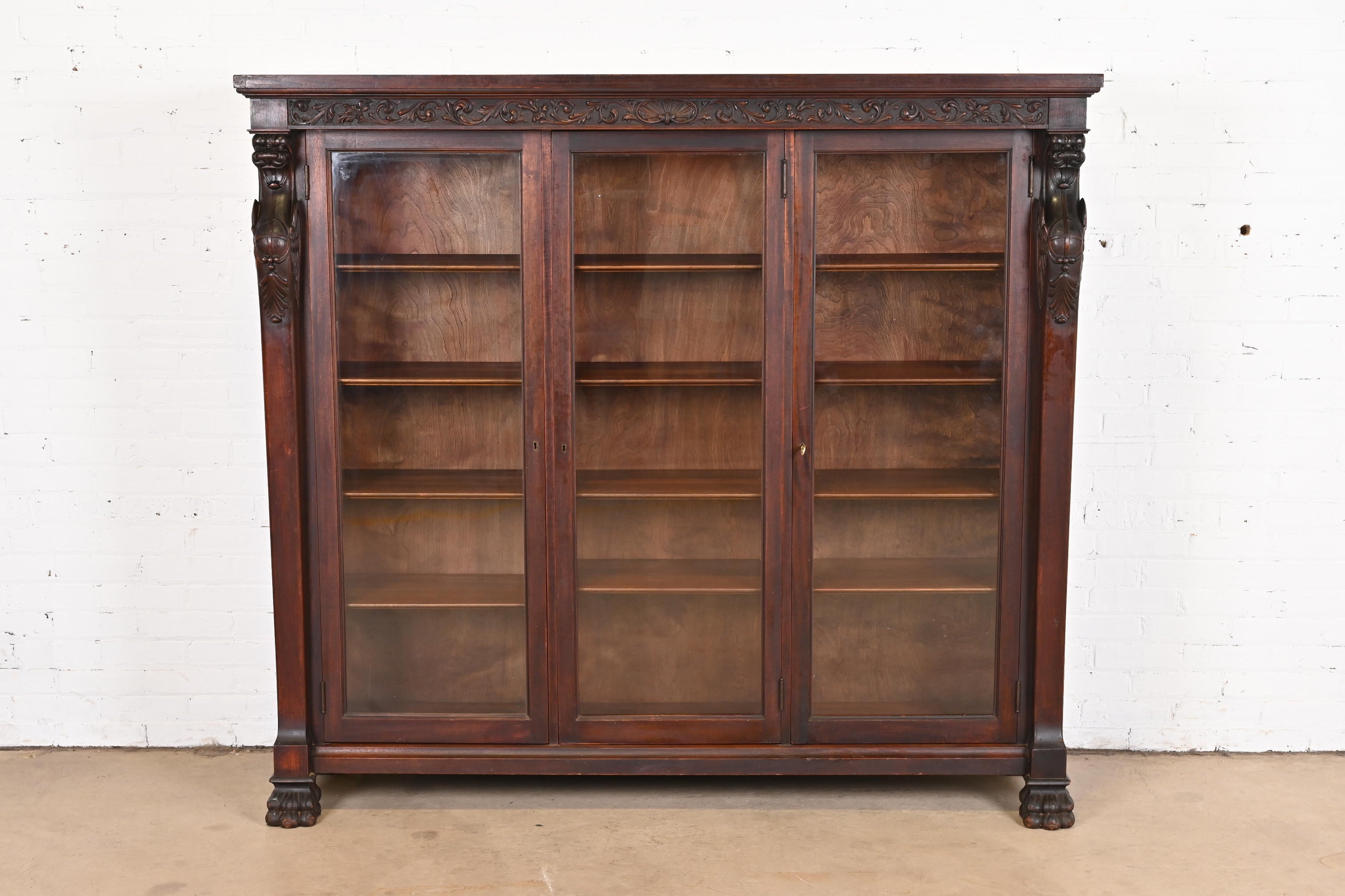 R.J. Horner Victorian Mahogany Triple Bookcase With Carved Griffins