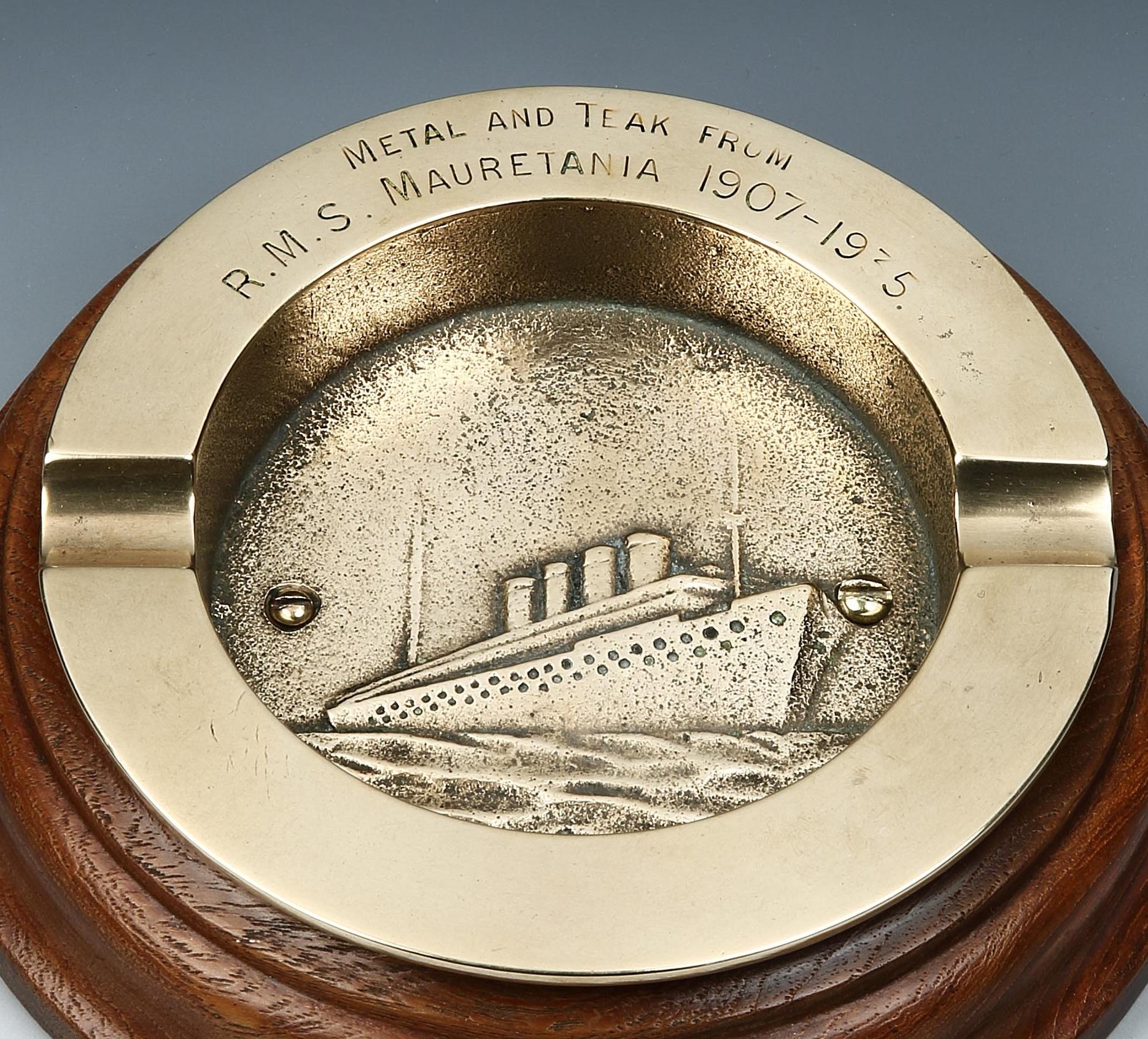 R.M.S Mauretania

A commemorative ashtray made from materials salvaged from one of the greatest ocean liners of all time, R.M.S Mauretania. The central polished brass bowl with polished teak surround has two cigar rests and an image of the liner