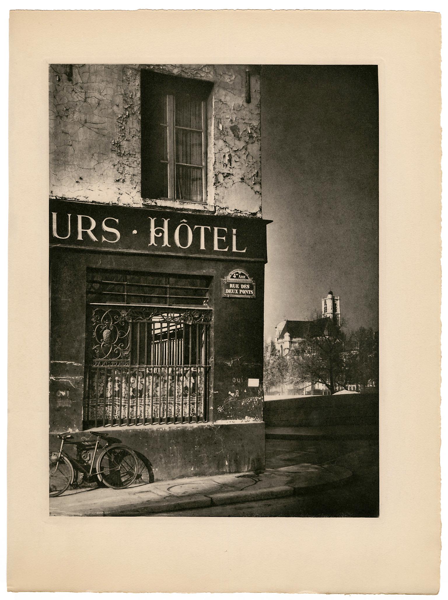Street Corner, L'Ile Saint Louis, Paris — Mid-Century Photogravure - Photograph by Rémy Duval