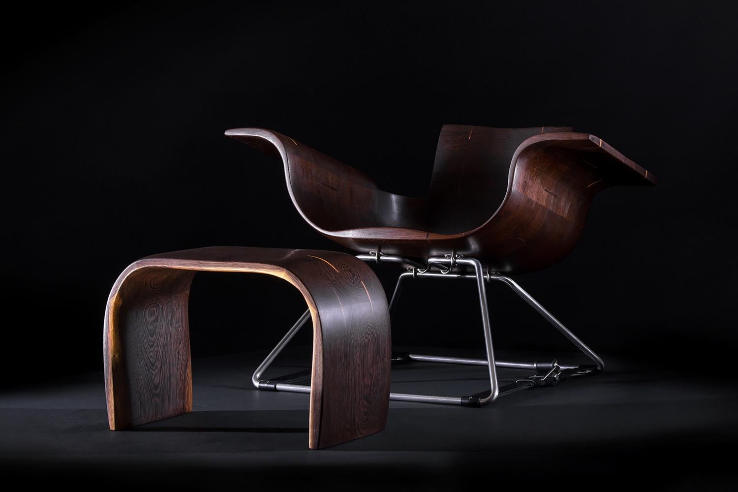 The Roadster armchair and footstool represent a stunning fusion of modern design and homage to the past. Crafted from solid wenge wood, vegetable-tanned leather, and stainless steel. The artist's inspirations are evident in the sleek lines