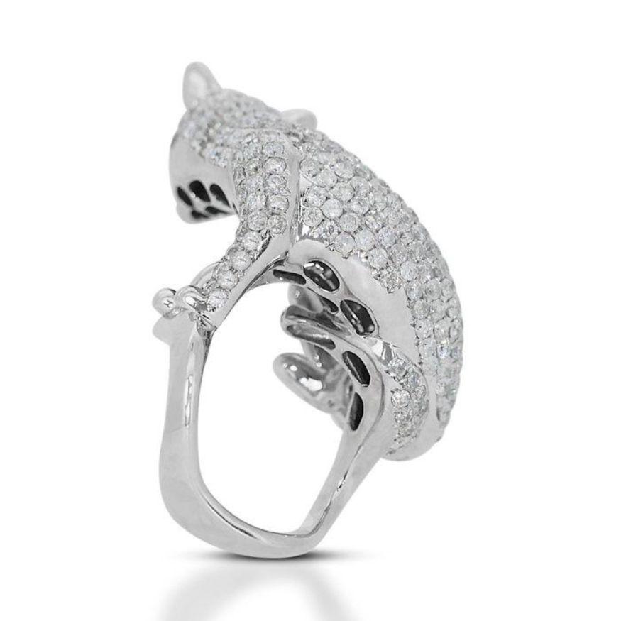 This ring isn't just jewelry; it's a roar of audacity, a captivating whisper of wild beauty. Embracing the sleek majesty of a tiger, it shimmers with 6.53 carats of round brilliant diamonds, their I-J color and SI-I2 clarity adding a subtle fire to