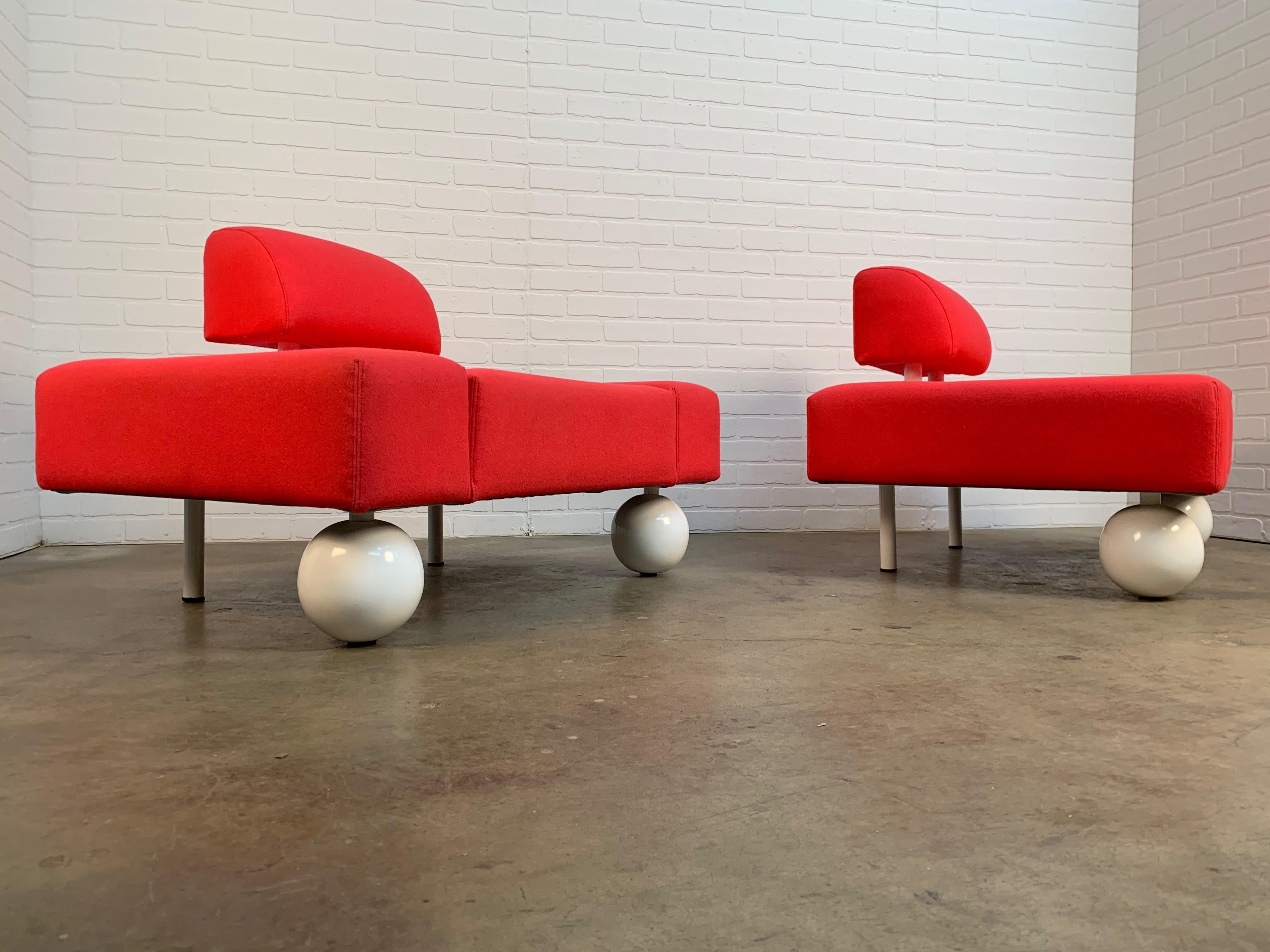 Rob Eckhardt for Pastoe hot pink Postmodern lounge chairs with metal globe front legs.