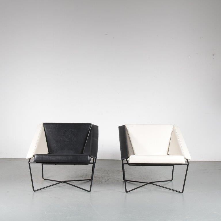 A lovely set of two lounge chairs, model “Van Speyk”, designed by Rob Eckhardt and manufactured in very small amount by Pastoe in the Netherlands in 1984.

The chairs have black lacuqered tubular metal bases in nice geometric shapes. These shapes