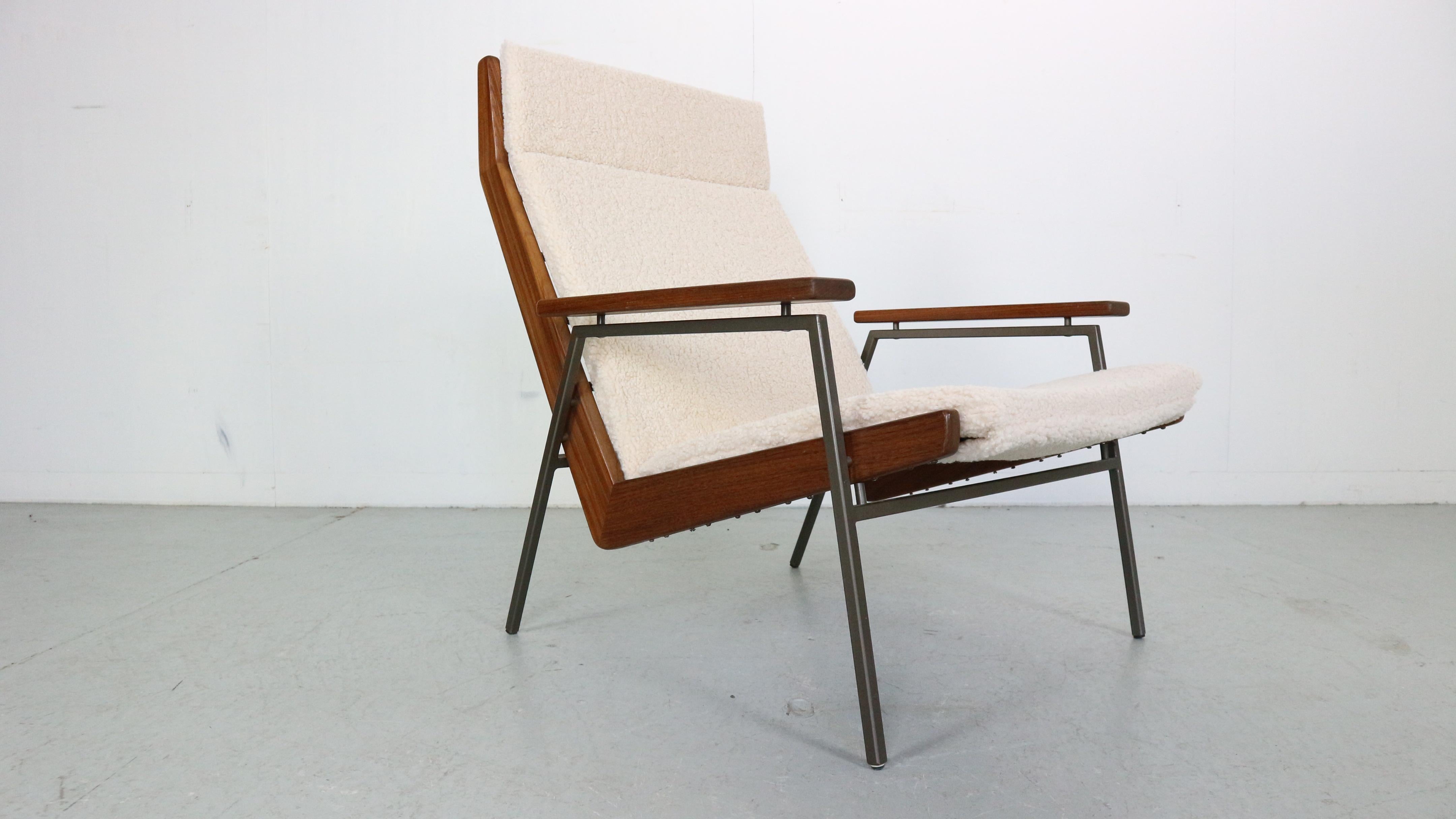 Mid- Century modern period lounge/ armchair designed by Rob Parry in 1952 for furniture factory Gelderland, The Netherlands.
Model Number:  1611 also called Lotus chair.
 This version has a grey metal frame, a teak wooden edge and a 