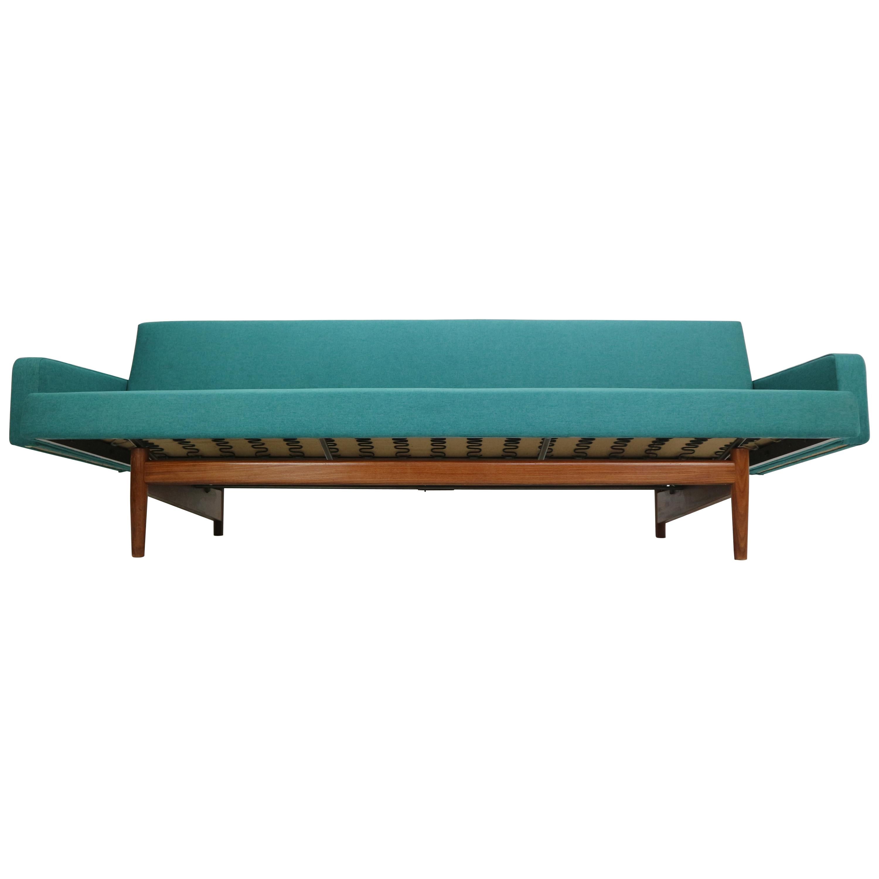 Rare sofa designed by Rob Parry for Gelderland, 1960s.
Minimalistic and elegant Dutch design pride.
With one movement, the seat can be pulled out into a single sofa bed.
Measurements: 89cm.
This sofa bed has a teak elegant base and is