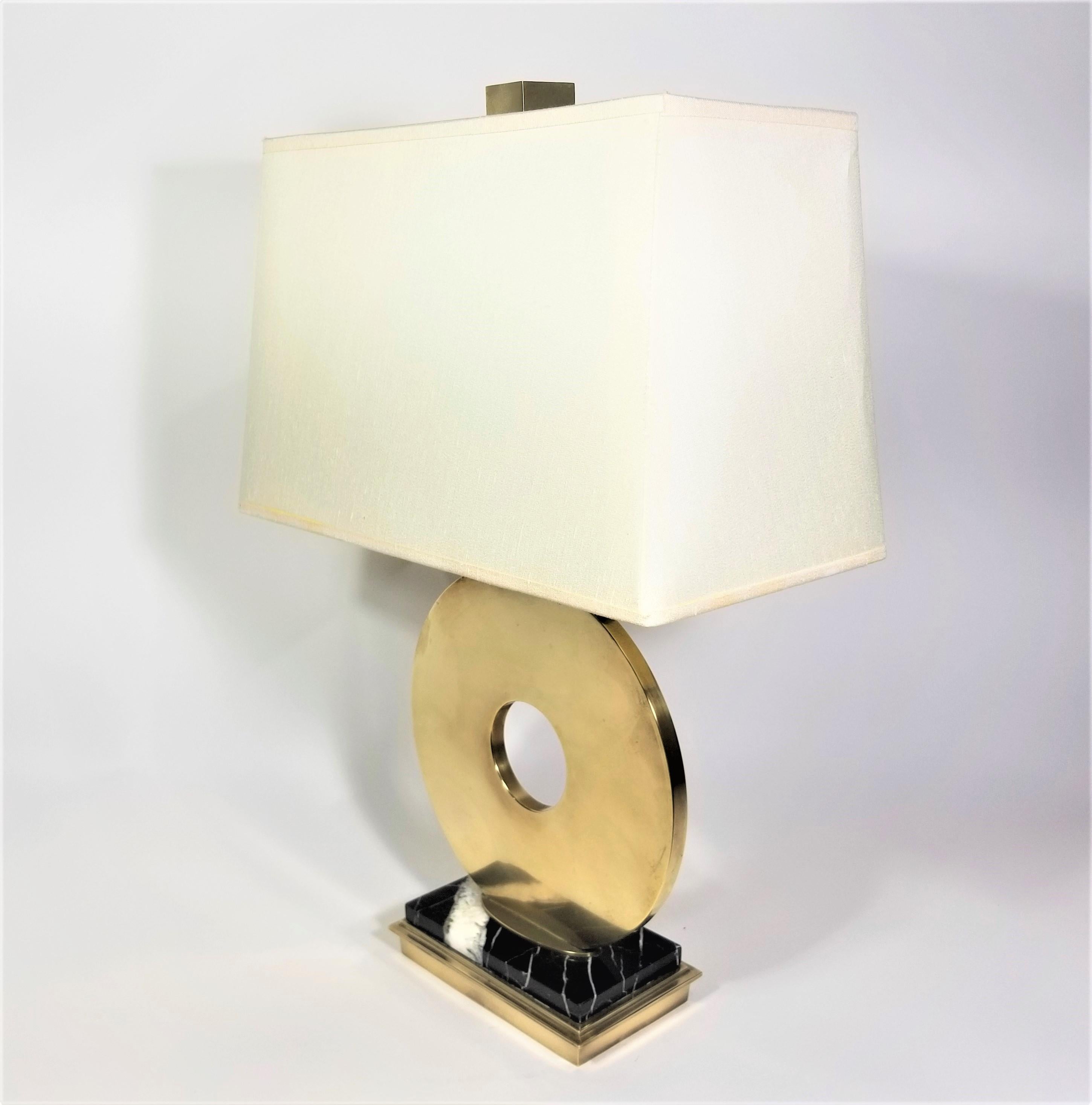 Vintage Robert Abbey table lamp. Solid brass and marble. Black marble with white veins. Modernist Abstract Design. Original shade with Robert Abbey Inc Marking. Brass cube finial. 

