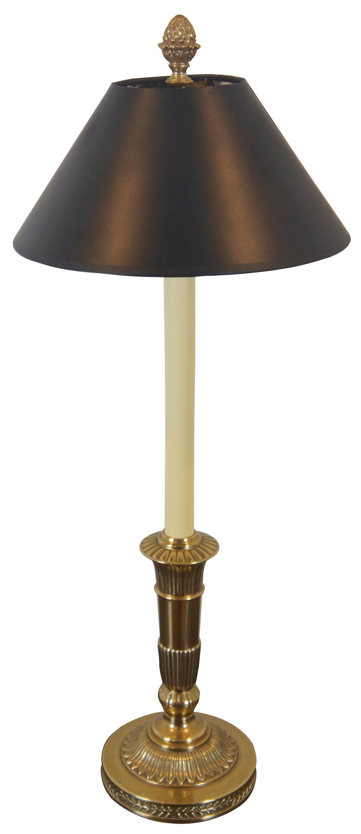 Robert Abbey Inc brass candlestick shaped table lamp with acorn finial and black shade with reflective interior.

Measures: 7” x 32.5” / Shade - 13” x 6” (diameter x height).
 