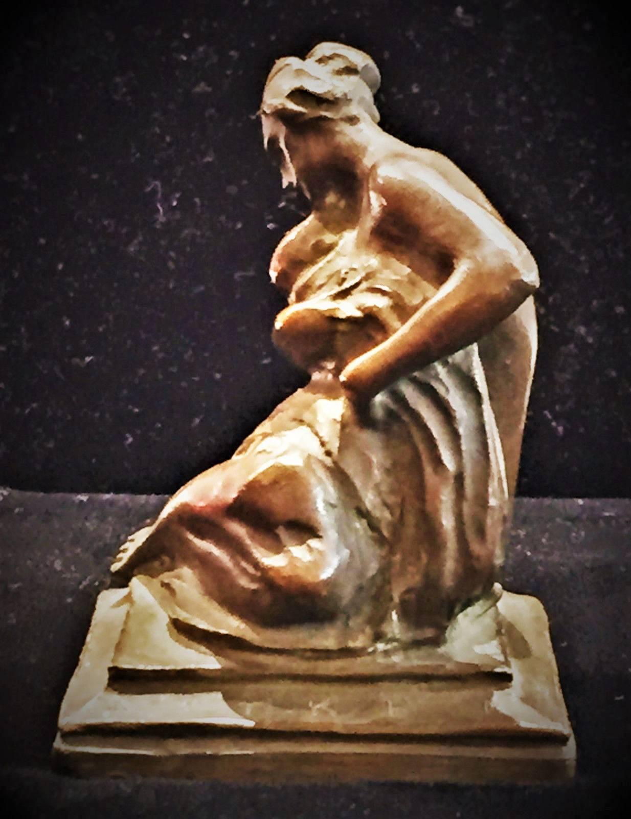 The nurturing young mother depicted in the nude, resting on the ground and cradling her infant. The sculpture is signed by the artist on the plinth of a stepped square base.

Robert Ingersoll Aitken (1878-1949), a noted American sculptor was born in
