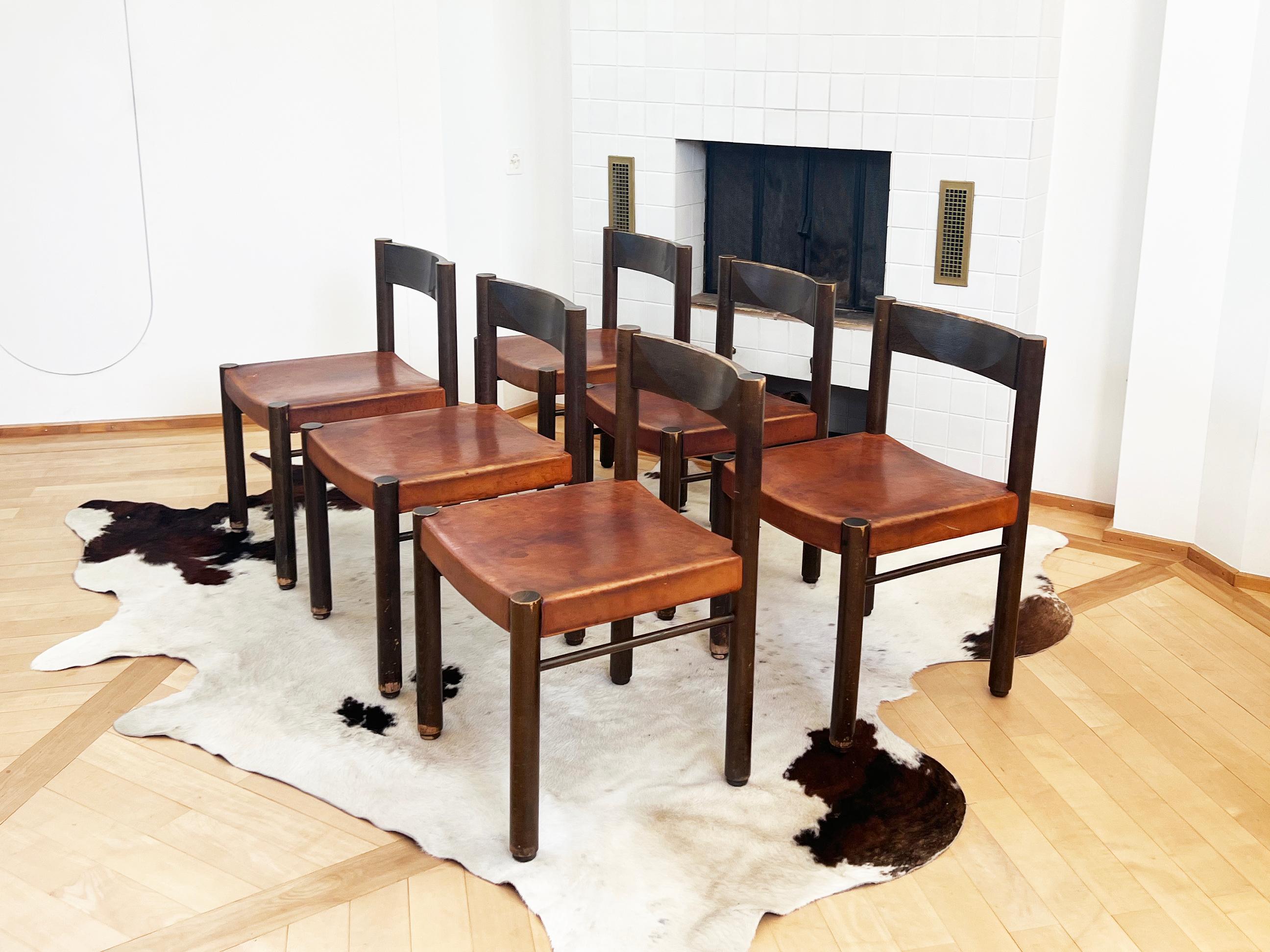 Set of six 1960s ICONIC and rare tiger oak wood and saddle leather seat chairs model 6200 by Robert and Trix Haussmann from Zurich Switzerland. In very good used condition, well worn in patina leather

Ergonomic and very comfortable designer