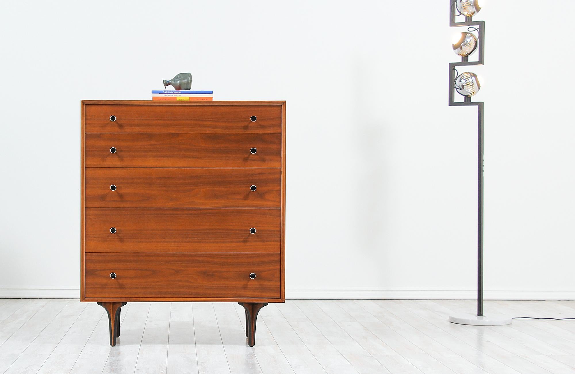 Beautiful vintage chest of drawers designed by Robert Baron for Glenn of California in the United States circa 1950s. This handsome, tall chest design features five spacious drawers with metal hourglass pulls that create a simple modern aesthetic.
