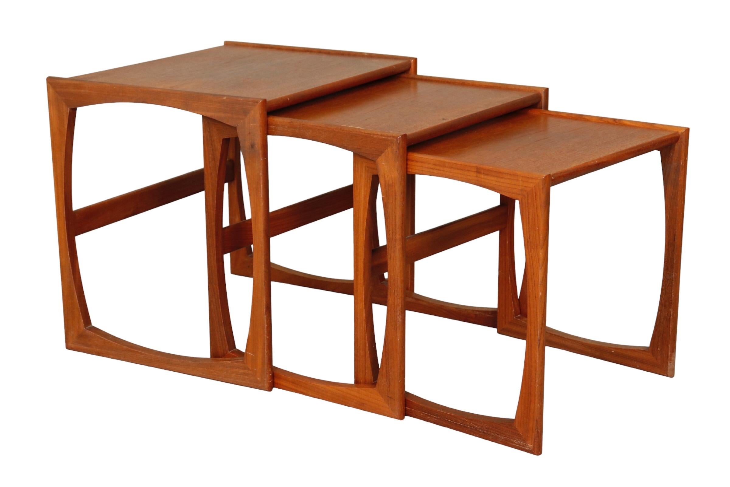 A set of three nesting tables designed by Robert Benett for G Plan. Cube shaped tables are made of teak.

The largest table measures 18.75”height x 17” wide x 21.25” deep.