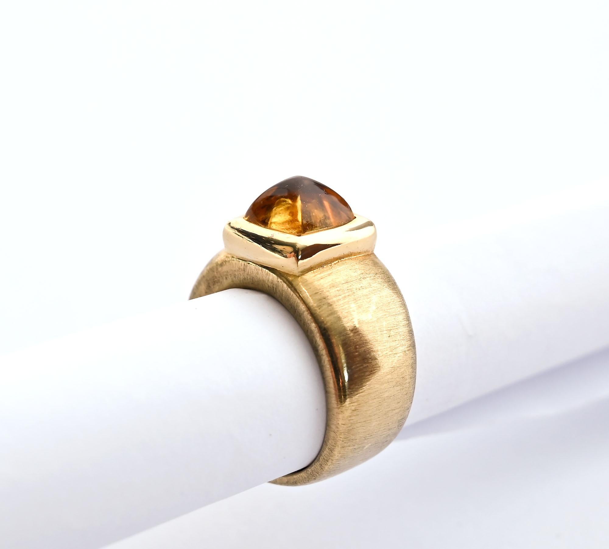 Gold and citrine ring by American designer, Robert Bielka.  Bielka arrived in New York in 1975 where he worked for Cartier. In 1979, he began his own firm where he sold to such notables as Tiffany; Van Cleef and Arpels and Harry Winston.
This heavy