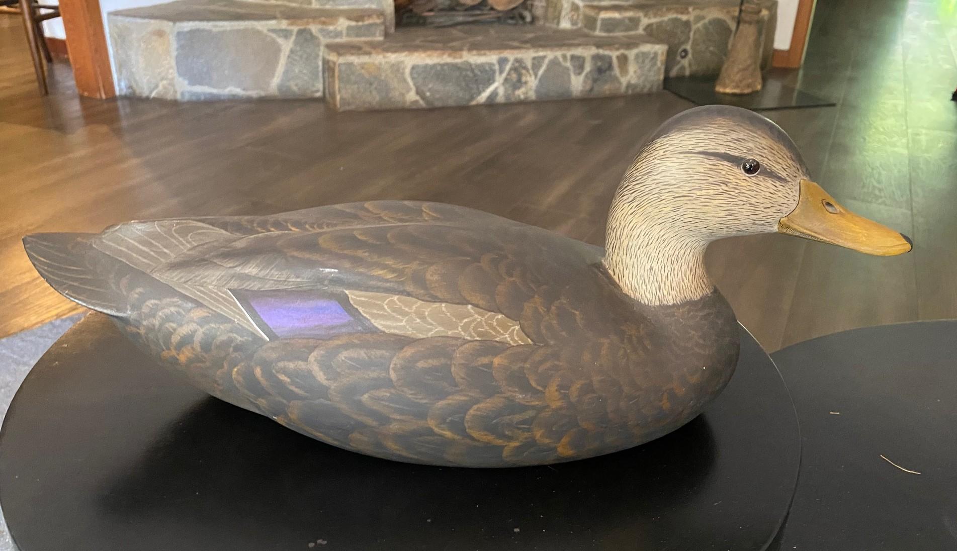 A wonderful work, hand carved and painted by renowned Canadian duck decoy artist Robert (Bob) Kerr (b, 1935).  Beautifully crafted and decorated.

The work is signed/branded with Kerr's duck mark and 
