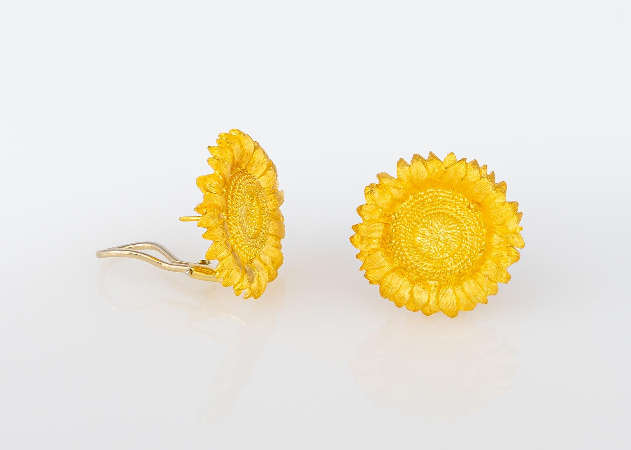 Robert Bruce Bielka's sunflower motif earrings are a classic. The detailing and hand applied finish are exceptional. At just over 1 inch these are your new go to wearable gold earrings.