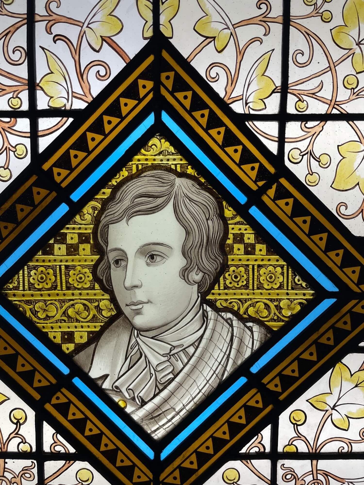 A late 19th century antique stained glass window panel depicting Robert Burns, one of 3 similar we are selling depicting notable figures of British history. At the centre is a distinguishable illustration of Robert Burns, 18th century Scottish