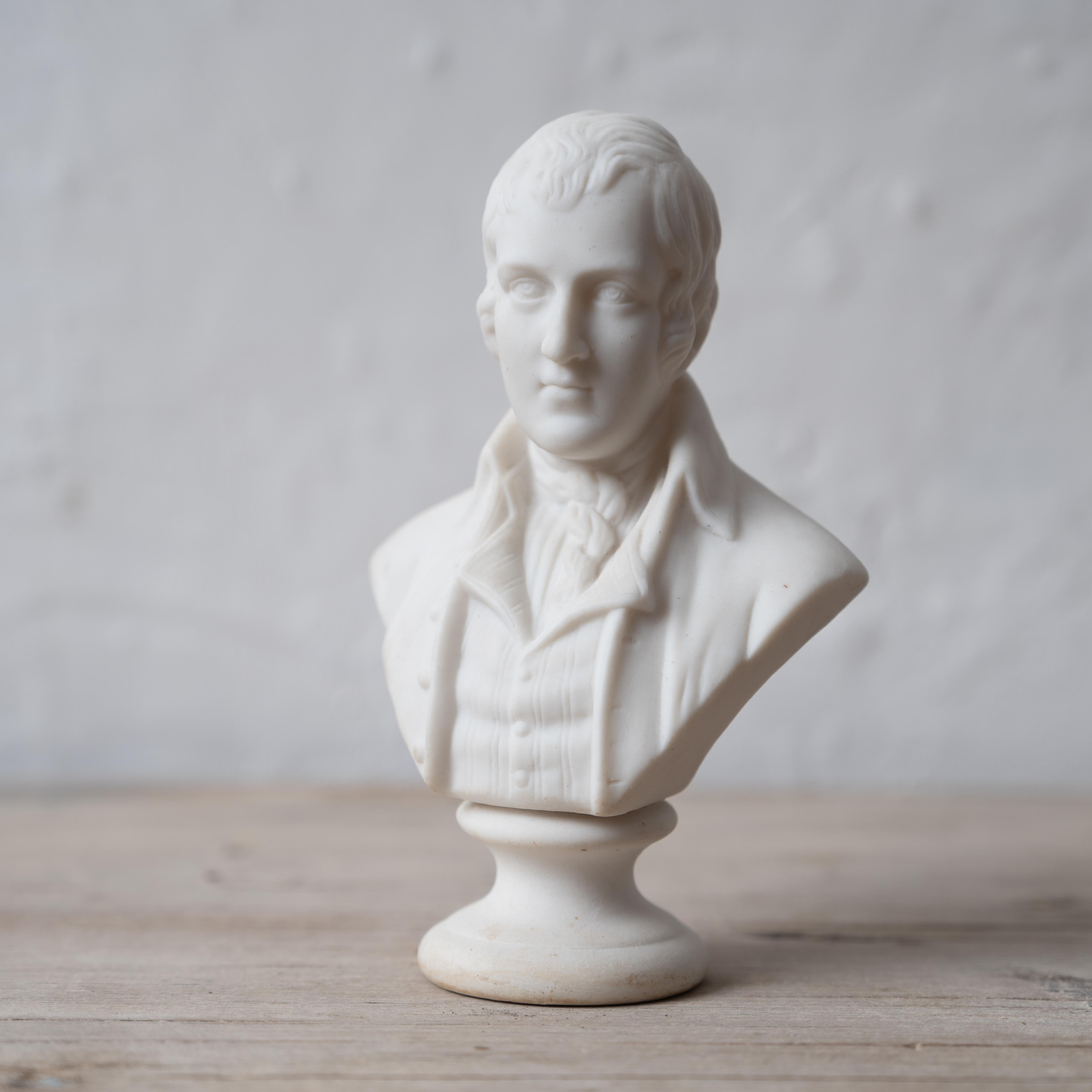 A parian bust of Robert Burns, late 19th century.

3 ½ inches wide by 2 ½ inches deep by 5 ½ inches tall





